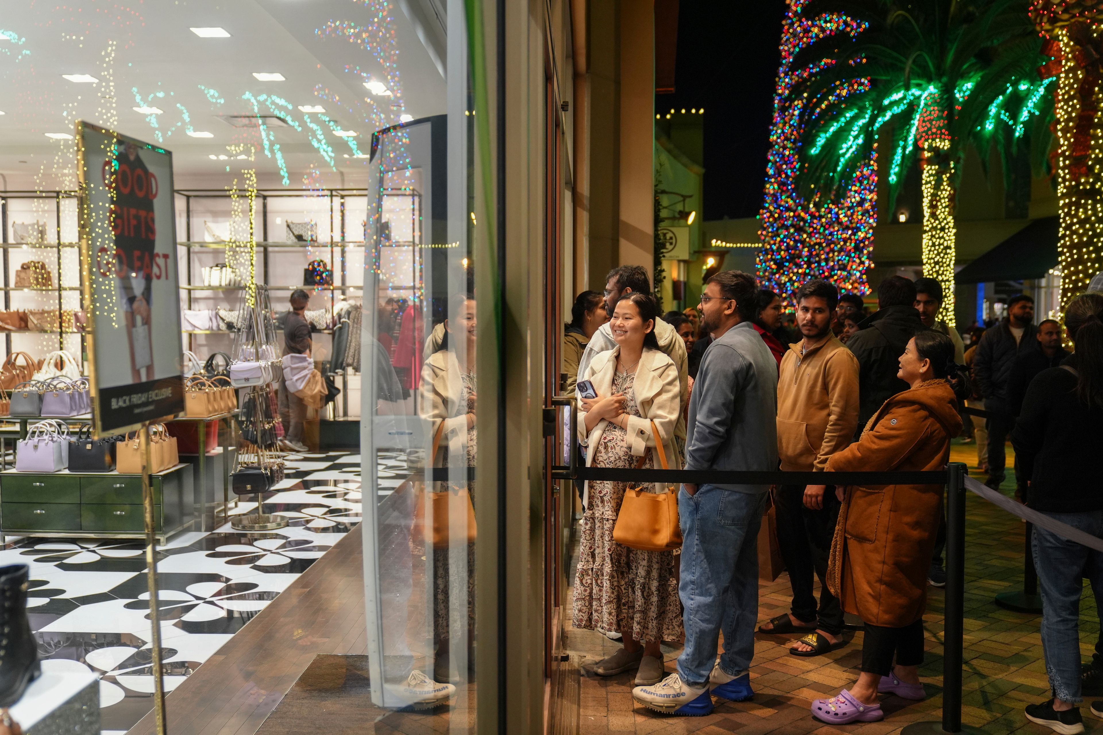 Early Black Friday shoppers line up outside stores at Citadel Outlets in Commerce, Calif., Thursday, Nov. 28, 2024. (AP Photo/Jae C. Hong)