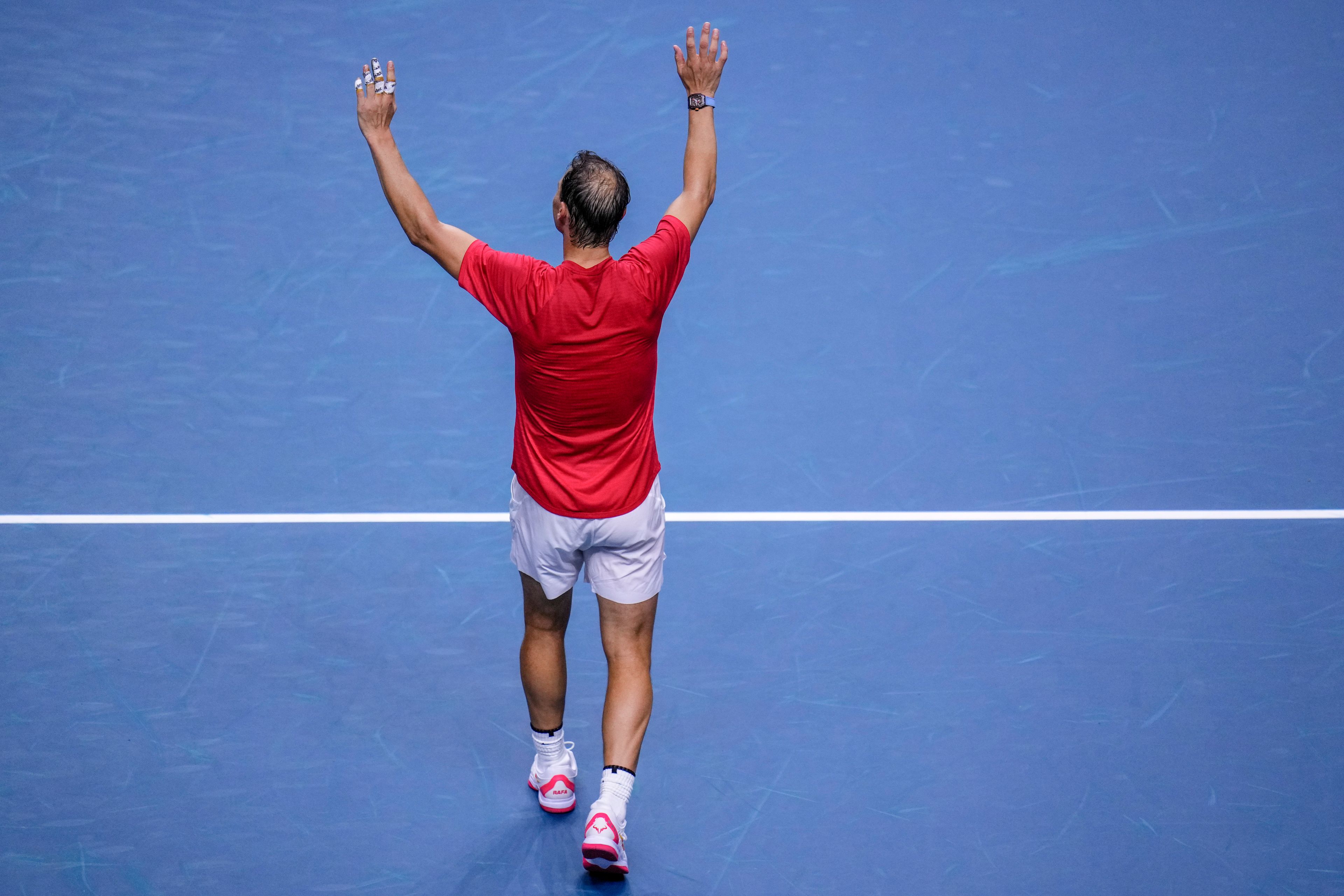 Spain's tennis player Rafael Nadal waves to the crowd after losing against Netherlands' Botic Van De Zandschulp during a Davis Cup quarterfinal match at Martin Carpena Sports Hall in Malaga, southern Spain, on Tuesday, Nov. 19, 2024. (AP Photo/Manu Fernandez)