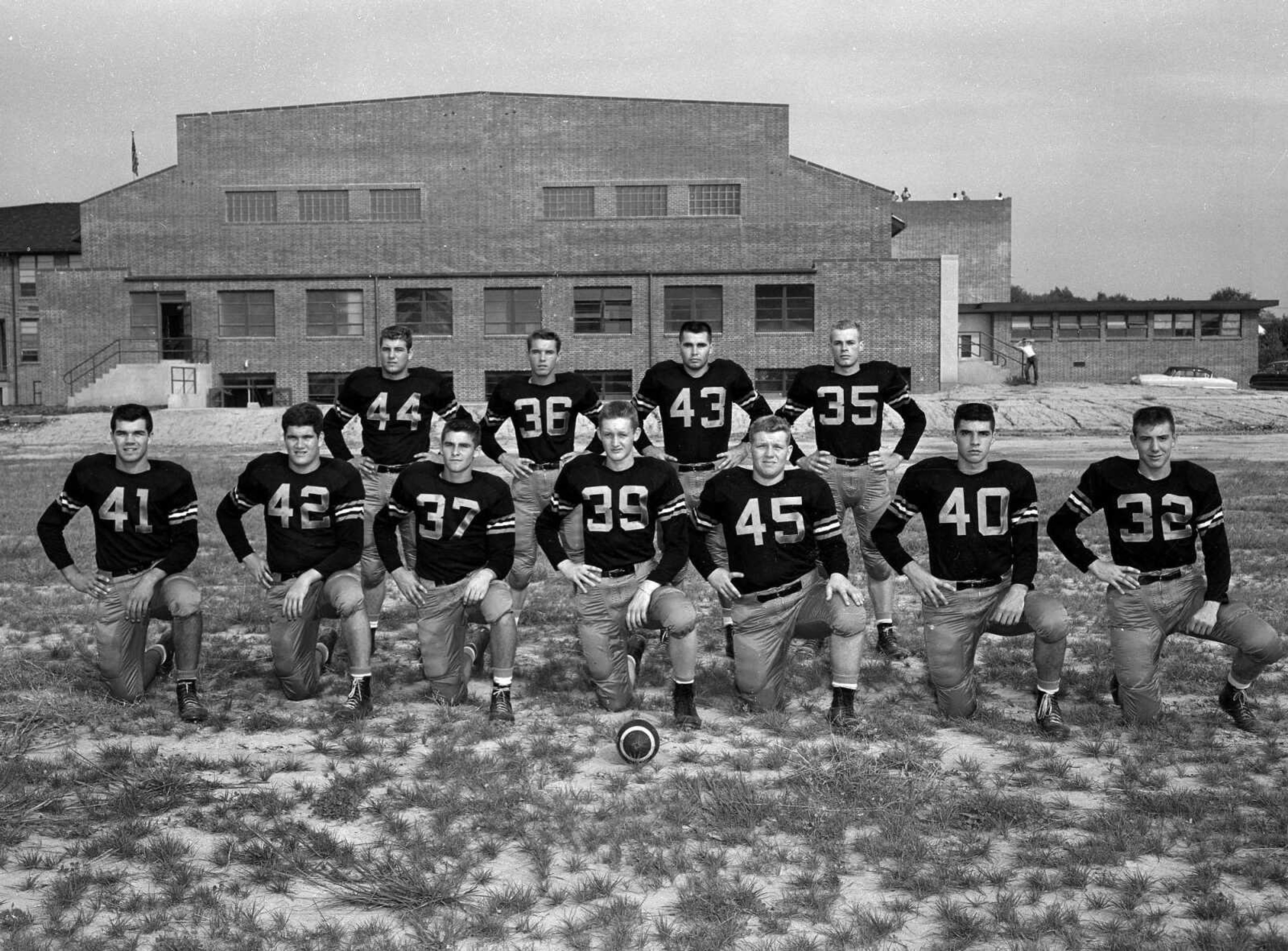 This photo was published Friday, Sept. 10, 1954 in the Southeast Missourian:
Here is the Central High School Tiger starting team in the opening gridiron game of the season tonight at Houck Field Stadium, against the Fredericktown High School Black Cats. The line, from left to right, Louis Meisenheimer, Jim Patmore, Tyrone Thompson, Earl Mackey, Marlin Buelow, 
Arthur Welch, Ronnie Hopper. The backfield, left to right, .....Poorman, Don Abla, Malcolm Shack and Robert Hunt. (The teams tied 13-13.) (Missourian archive photo by G.D. Fronabarger)