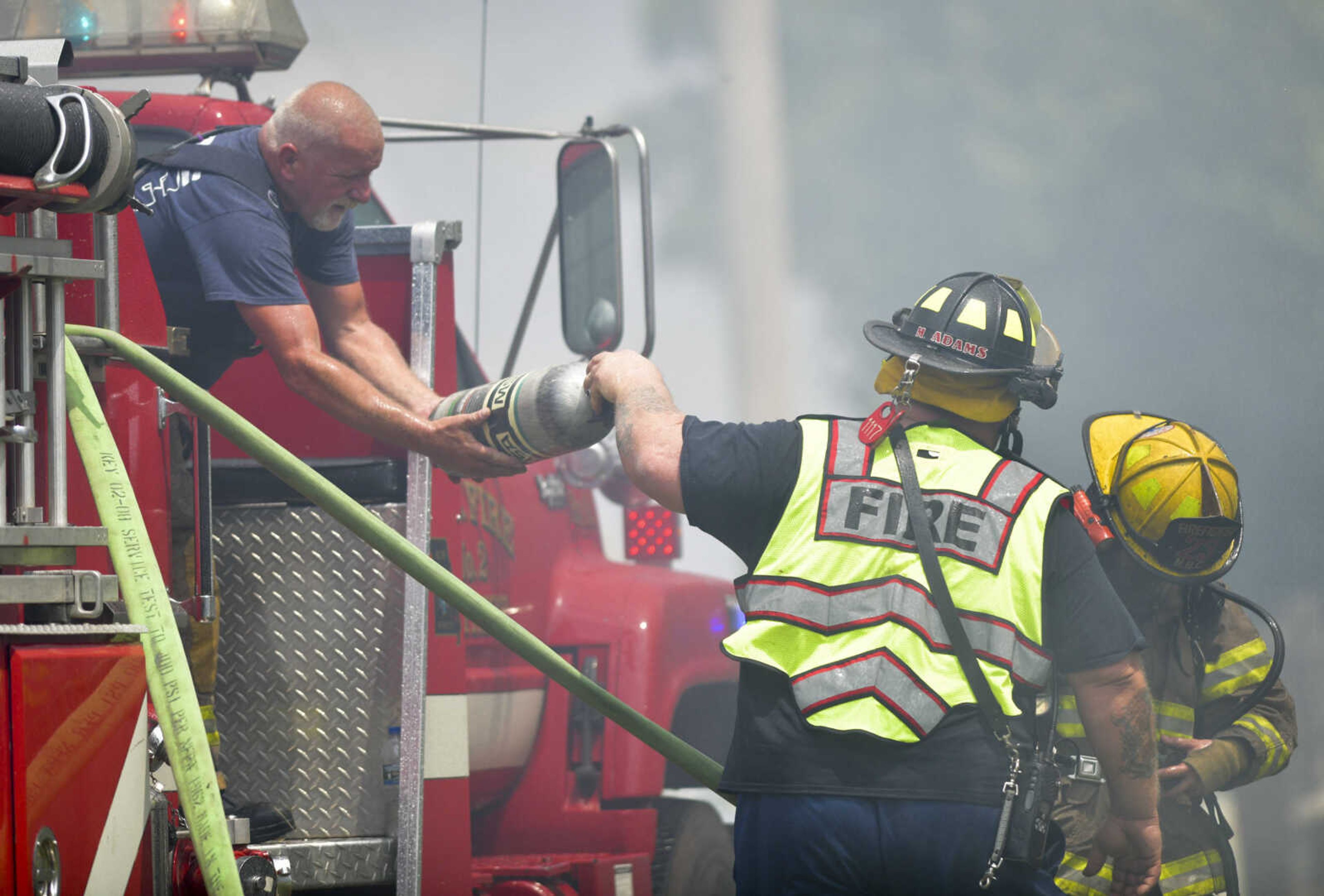 Members of the NBC Fire Protection District receive mutual aid from the Oran Fire Protection District, the Scott City Fire Department, the Scott County Rural Fire Protection District and the Scott County Sheriff's Office during a working fire Thursday, June 25, 2020, in the 300 block of Lake Road in Scott County between U.S. Highway 61 and Interstate 55.