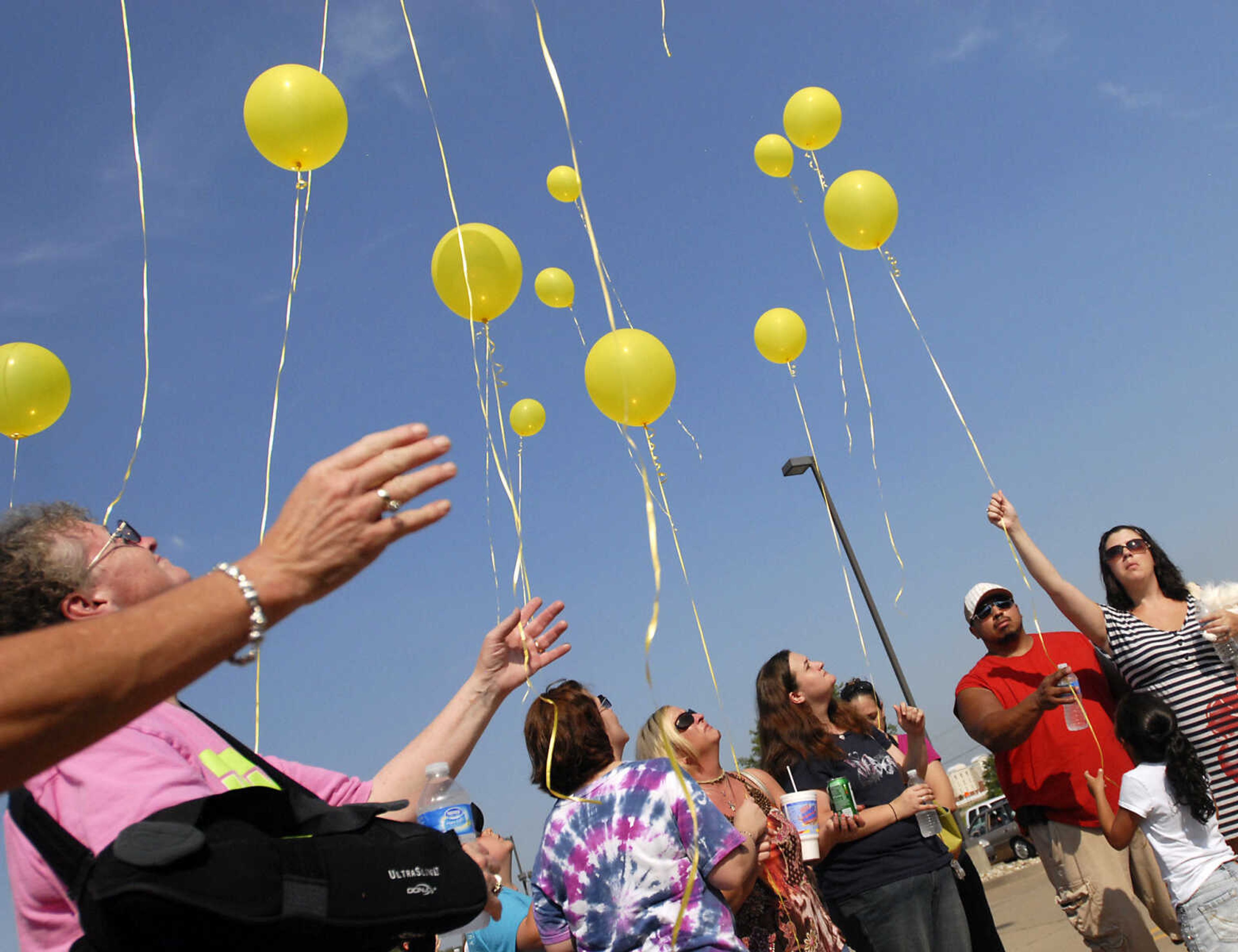 KRISTIN EBERTS ~ keberts@semissourian.com

Friends and family members release balloons during a prayer service for Jacque Sue Waller at Anthem Blue Cross Blue Shield in Cape Girardeau on Saturday, June 4, 2011. Waller, a 39-year-old mother of three has been missing since Wednesday.