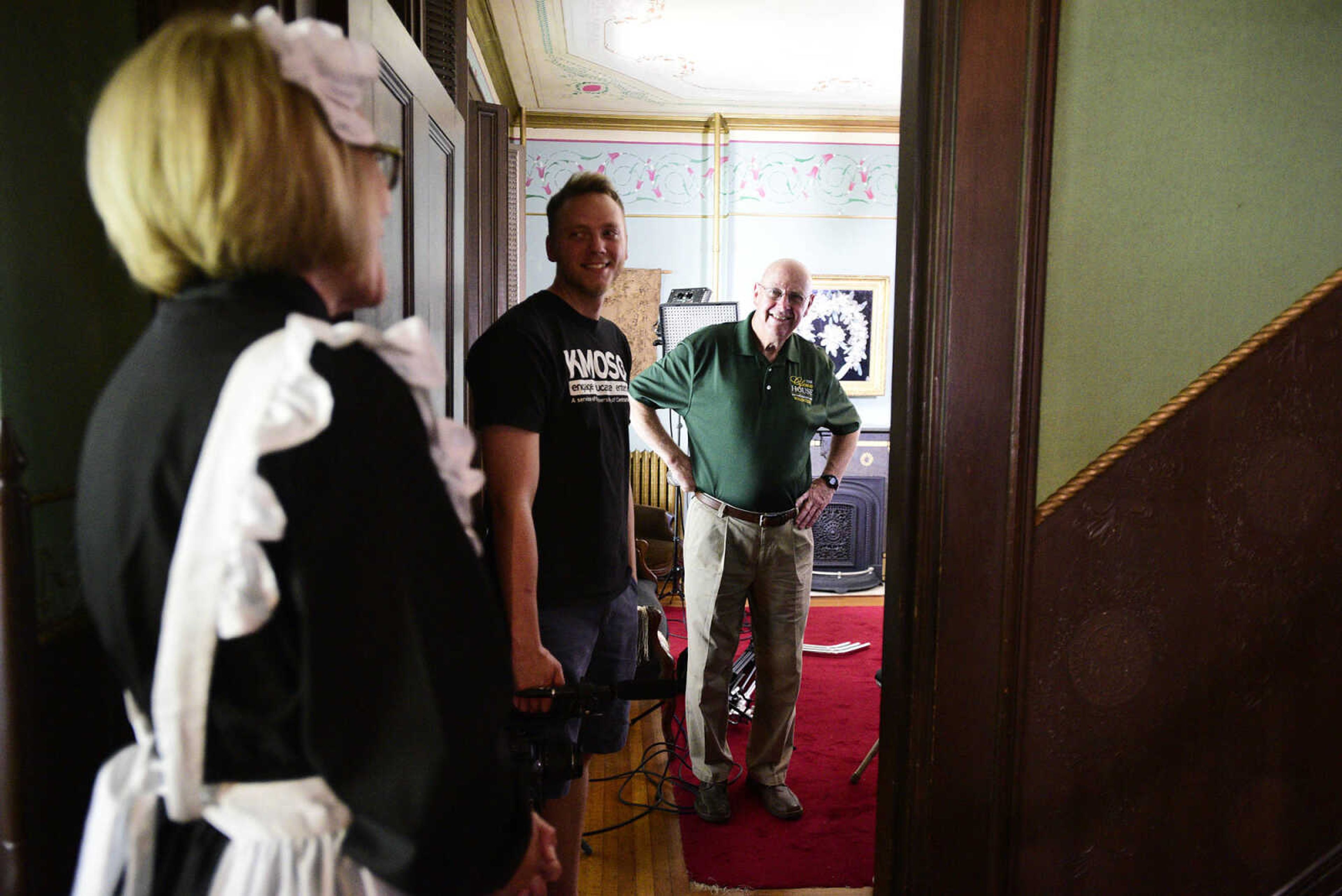 Volunteers Linda Ingram, left, and Tom Grantham, right, visit with Eric Boedeker from KMOS-TV on Wednesday, Aug. 16, 2017, in Cape Girardeau. KMOS-TV, a PBS affiliate, was filming inside the historic home for its Missouri Life show.