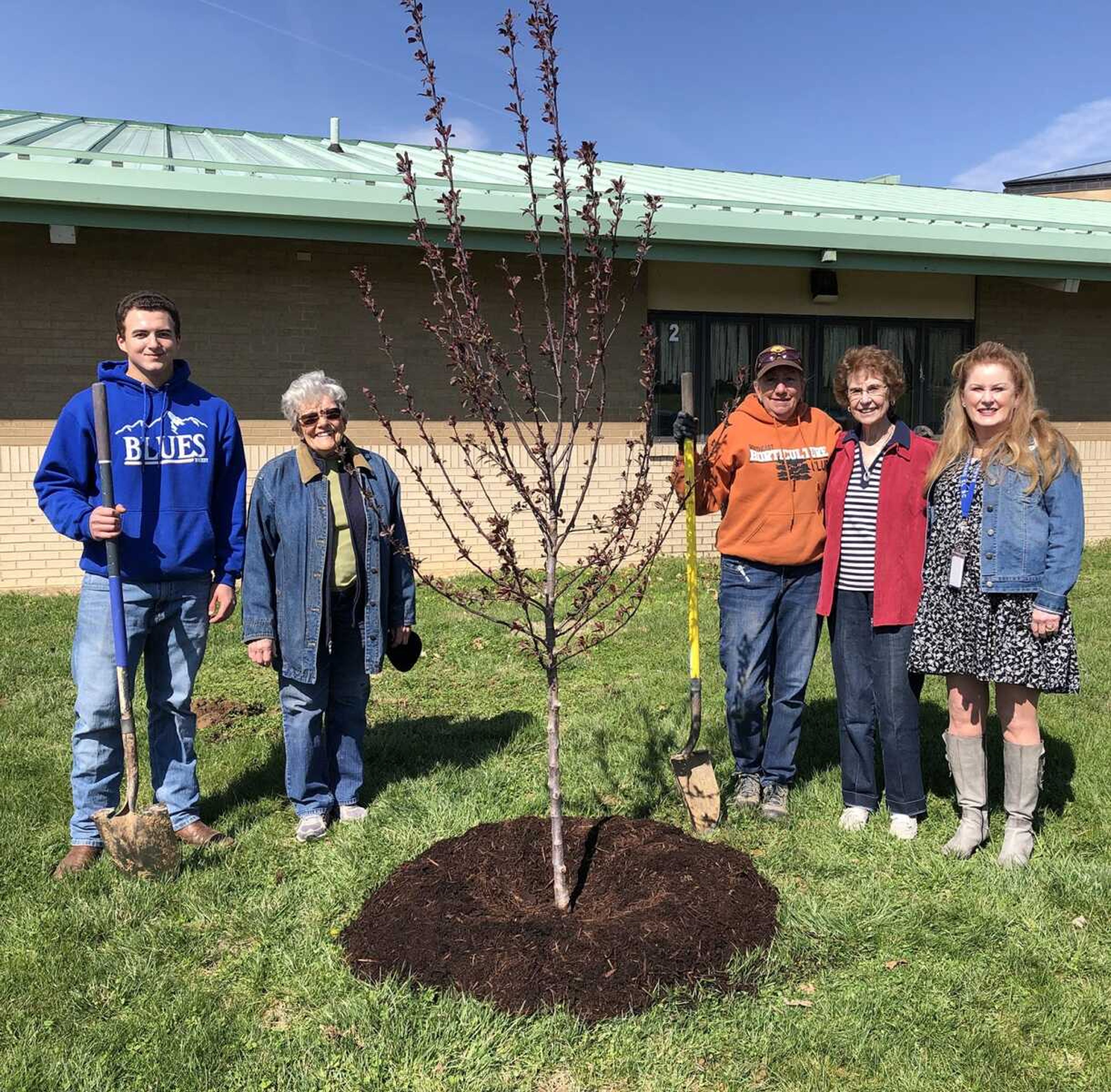 Missouri Arbor Day is coming! The Cape Girardeau Council of Garden Clubs is sponsoring the tree planting this year at Barbara Blanchard Elementary School. A celebration of Arbor Day was be held Friday with second-grade students participating in the ceremony. A flowering Crabapple Prairiefire tree (Malus) was planted in remembrance of Lynniah Green, a second-grade student at Blanchard Elementary, who was recently killed in an automobile accident. Shown above is the planting team of Jackson Basler, Southeast Missouri State University Agri-Business student; Ramblewood Garden Club members Nadine Davis, Arbor Day chairwoman,  and Bonnie Coy-Svenson; Barbara Blanchard, long-time Cape Girardeau Public Schools educator for whom the school was named and a Four Seasons Garden Club member; and Barbara Kohlfeld, school principal.