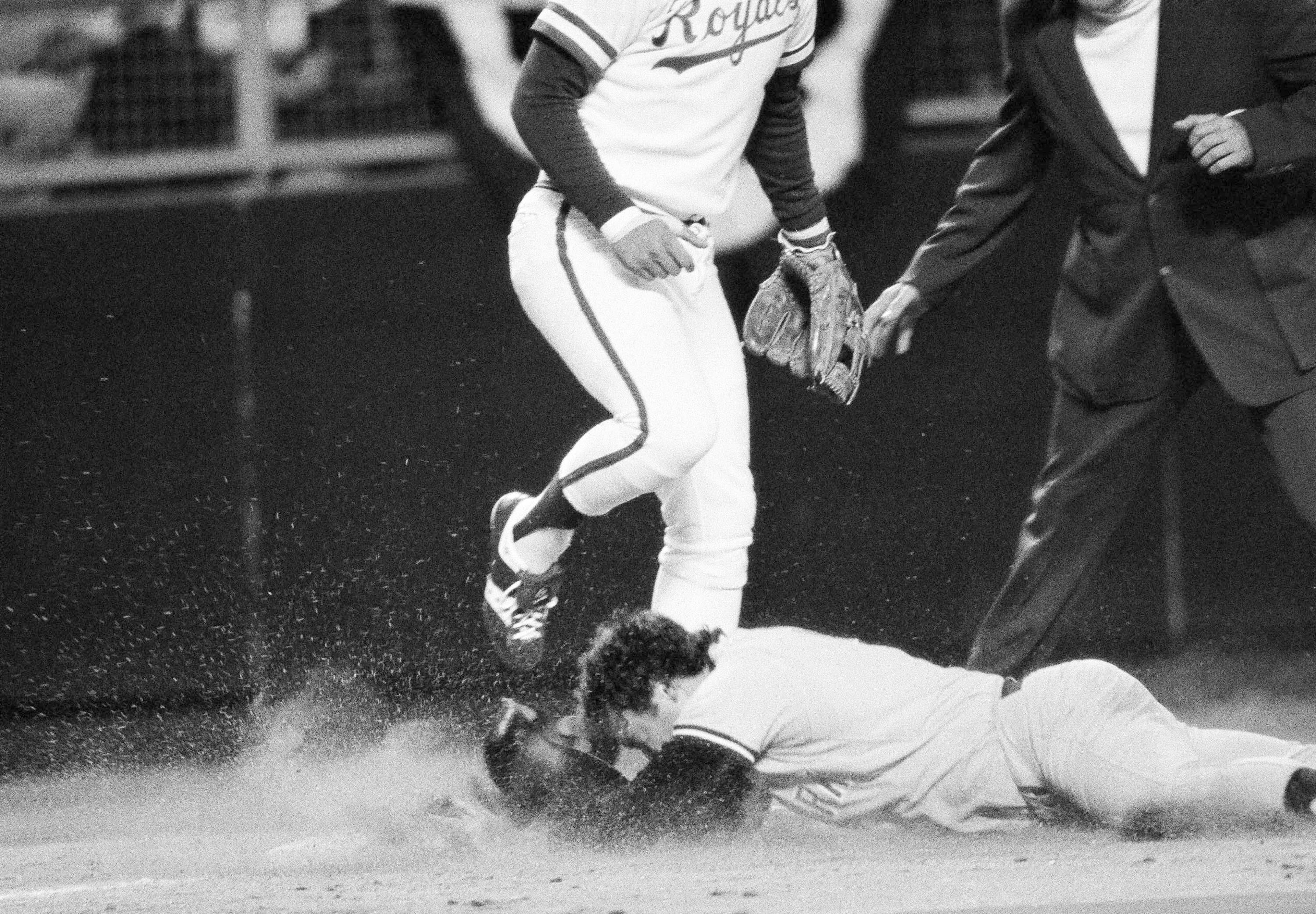 FILE - New York's Graig Nettles slides into the dirt and safe at third as Kansas City Royals George Brett covers in the fifth inning in the American League championship at Kansas City, Oct. 3,1978. (AP Photo/John File)