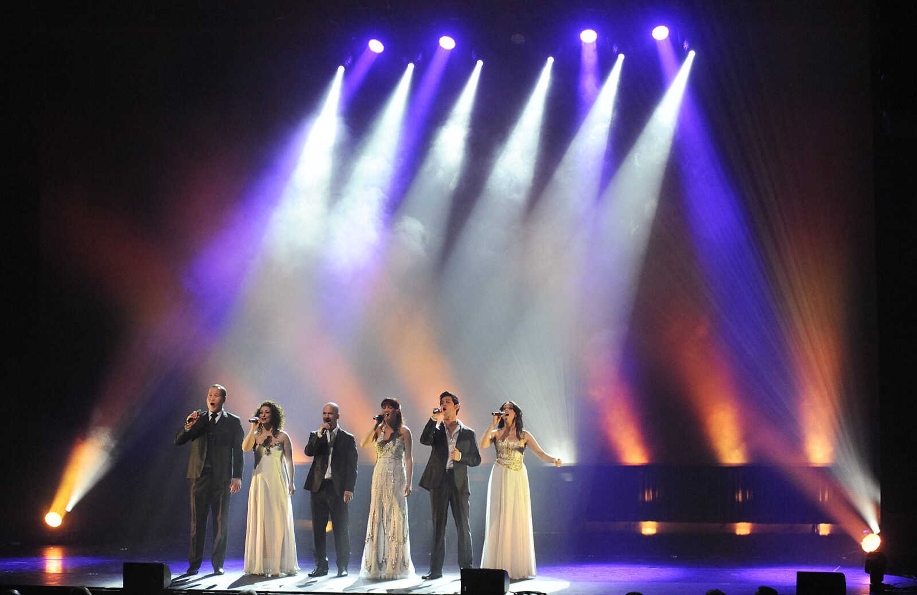 Derek Ryan, left, Rebekah Robertson, Derek Moloney, Suzanne Savage, Ross Wild and Una Pedreschi sing during during Celtic Nights, "The Emigrants Bridge," Wednesday, Feb. 27, at the Bedell Performance Hall at Southeast Missouri State University's River Campus. Featuring singers, dancers and musicians from Ireland and Scotland the production combines Celtic dance and music.