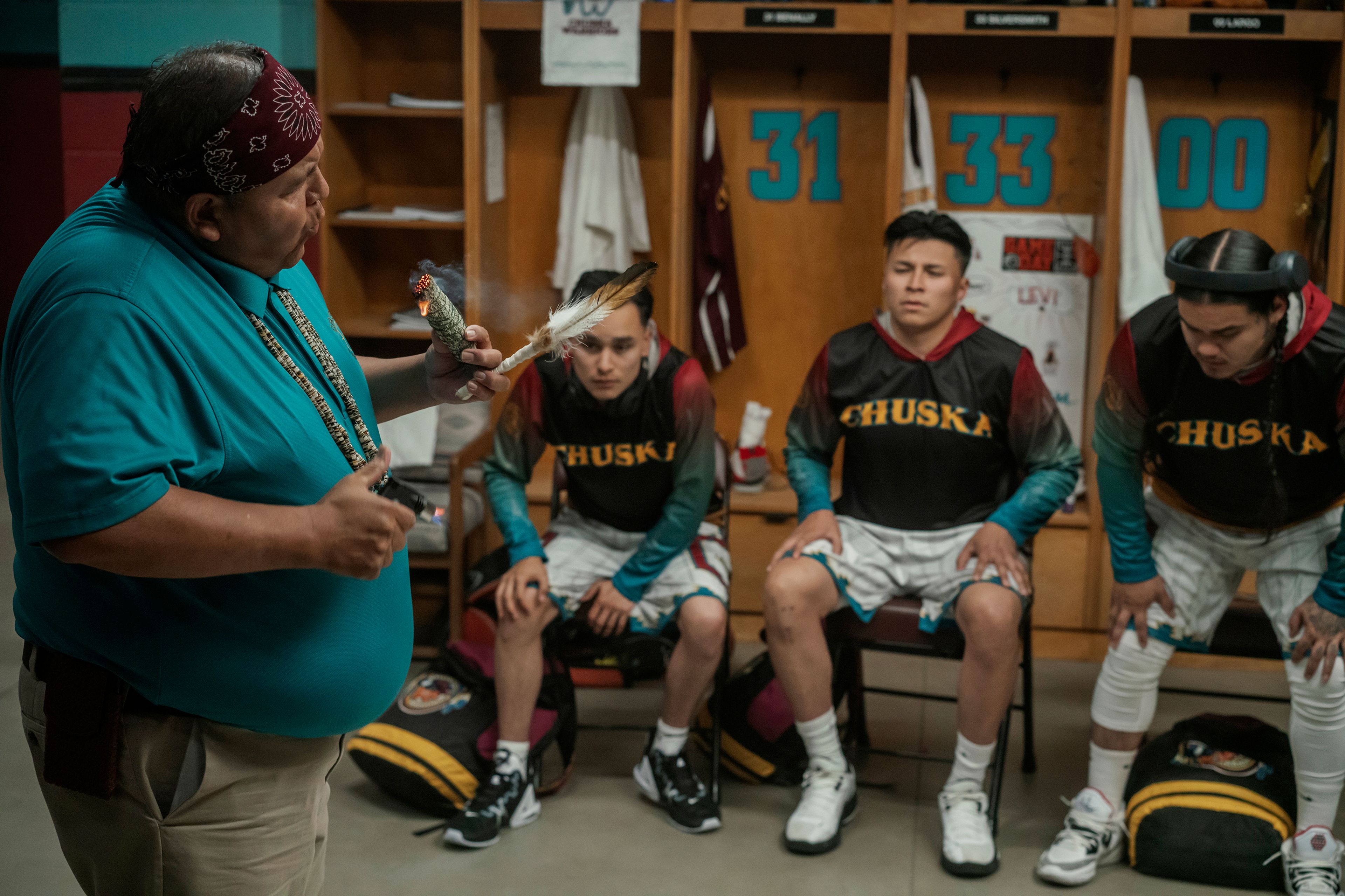 This image released by Netflix shows, from left, Ernest David Tsosie as Benny, Jaren K Robledo as Levi, Devin Sampson-Craig as Bryson and Damian Castellane as Ruckus, in a scene from the film "Rez Ball." (Lewis Jacobs/Netflix via AP)