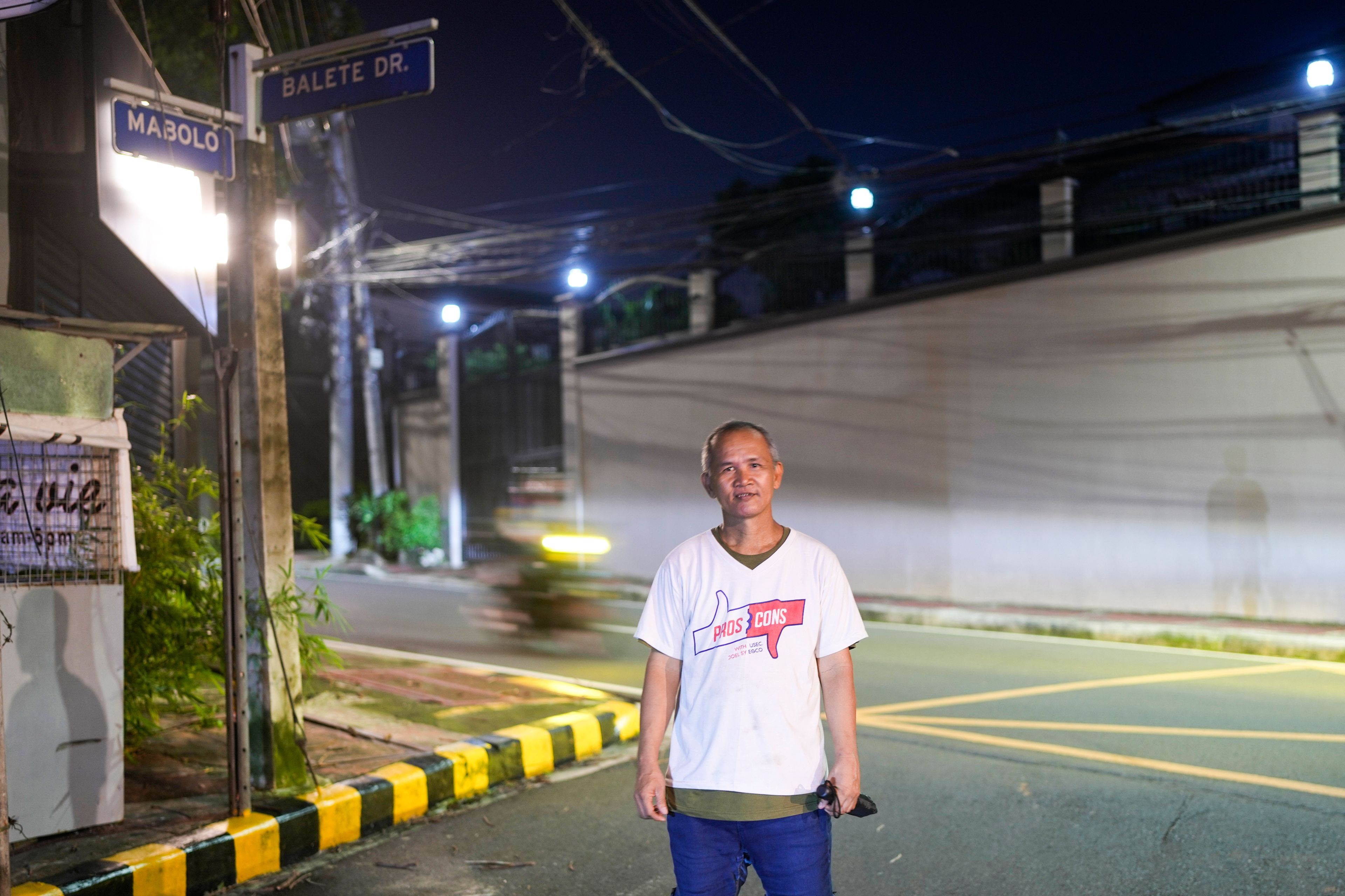 Roberto Perez, a 53-year-old who works part-time near Balete Drive, is seen here in Quezon City, Philippines, Friday, Oct. 25, 2024. (AP Photo/Aaron Favila)