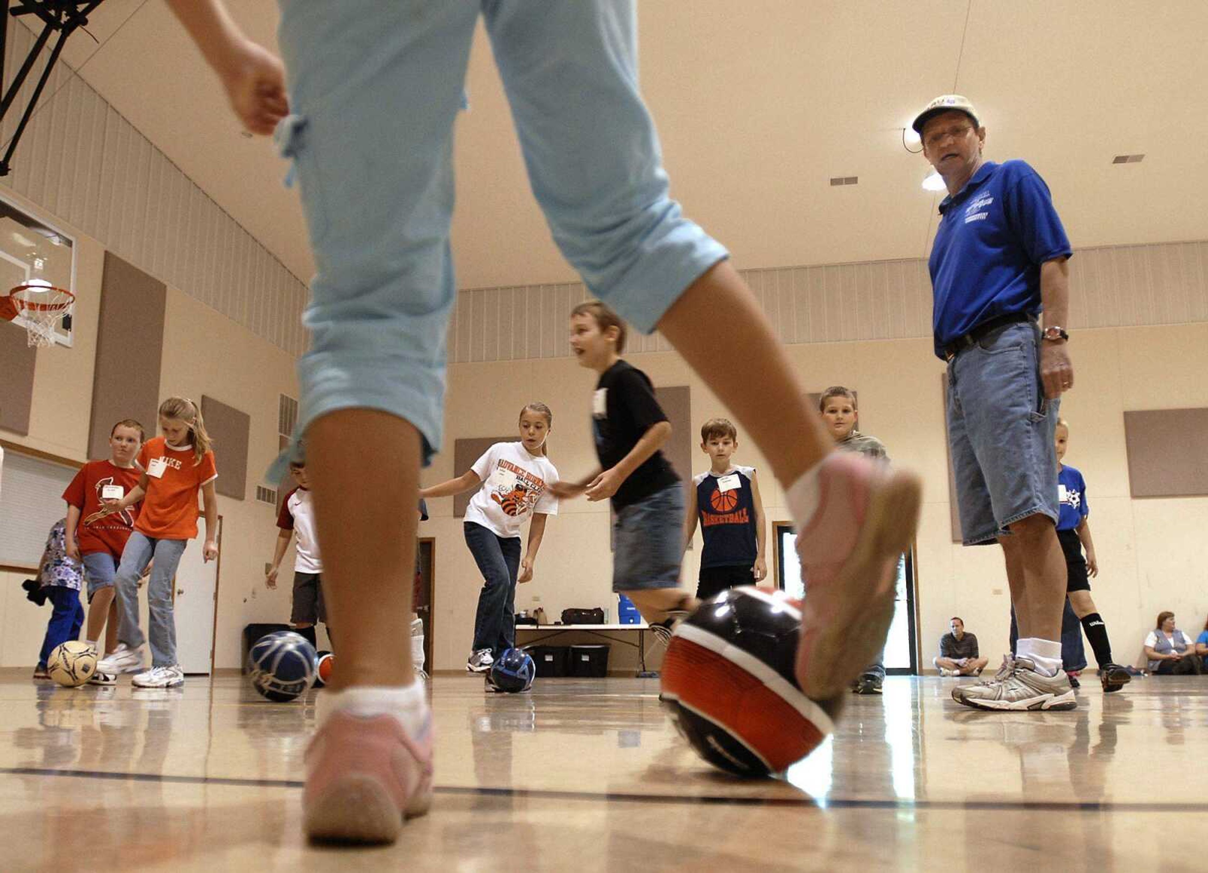 Mark Caplan supervises a physical education class with homeschooled students at Mount Auburn Christian Church. (Fred Lynch)