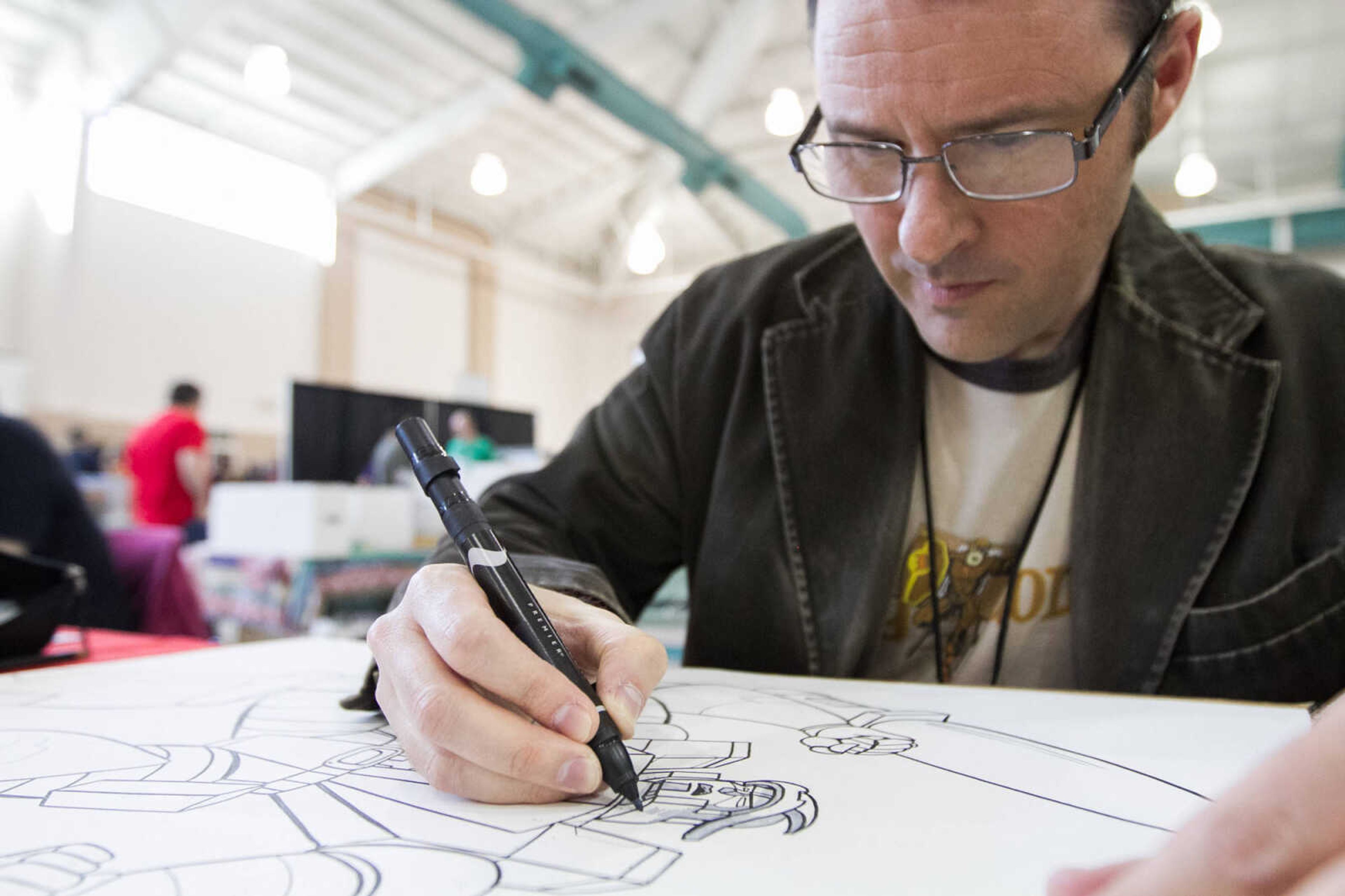 GLENN LANDBERG ~ glandberg@semissourian.com


Nathan Bonner works on a sketch of Galvatron at his booth during Cape Comic Con Friday, April 17, 2015 at the Osage Centre.