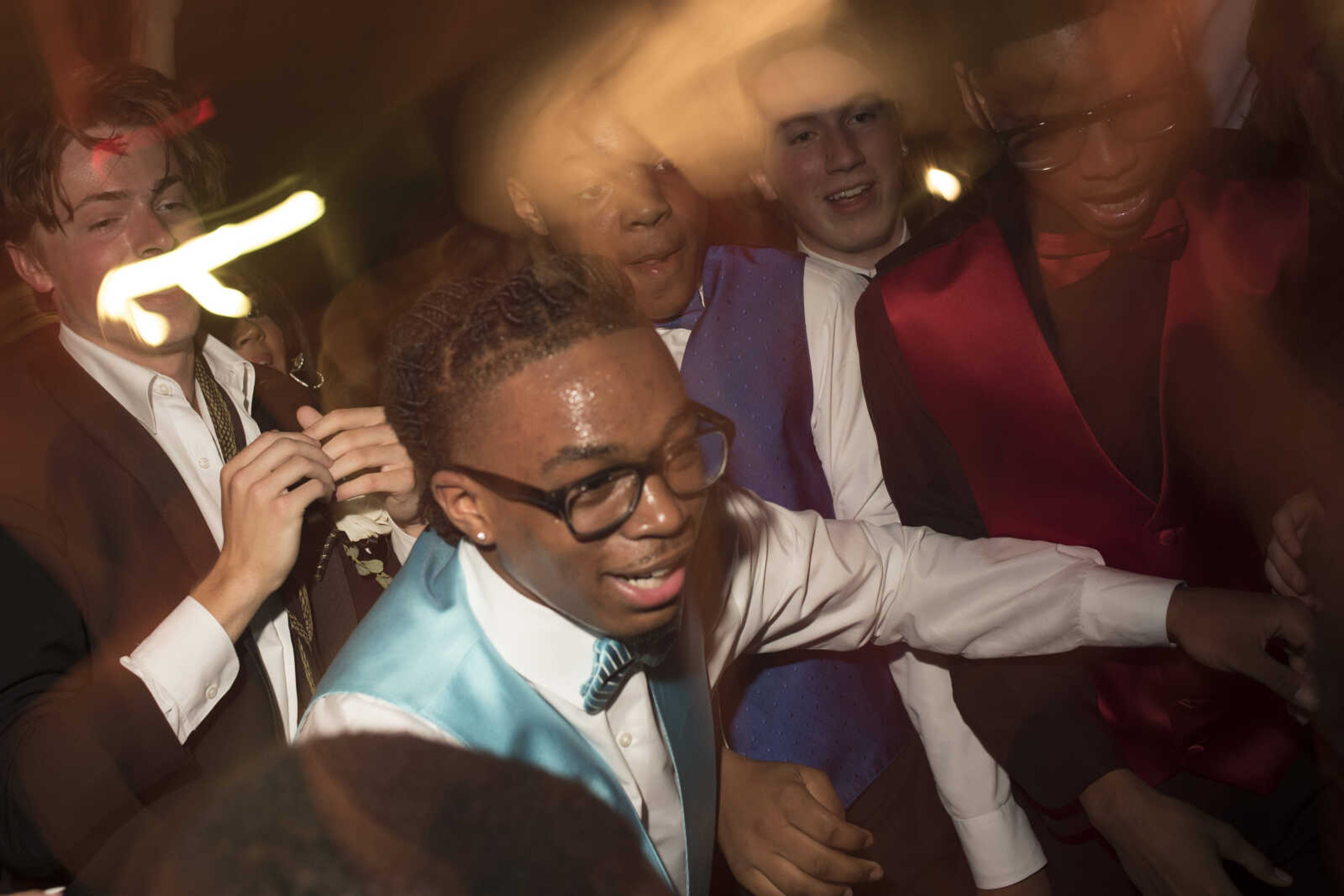 Prom King Chauncey Hughes, center, is seen shortly after crowd-surfing on the dance floor during Cape Central High School Prom Saturday, April 27, 2019, at Ray's Banquet Center in Cape Girardeau.