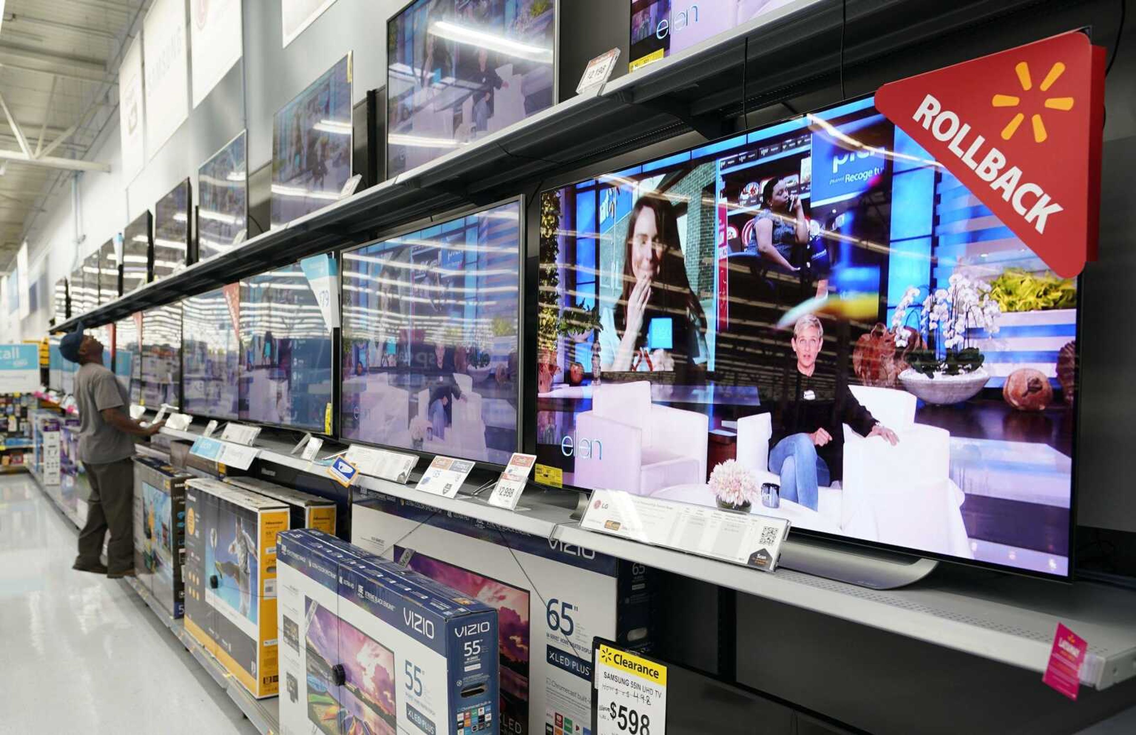 Shoppers look at televisions at a Walmart Supercenter in Houston. Executives at Walmart and dollar-store chains, which import much of their merchandise and serve many low-income customers, have warned tariffs could lead to higher prices for consumers.