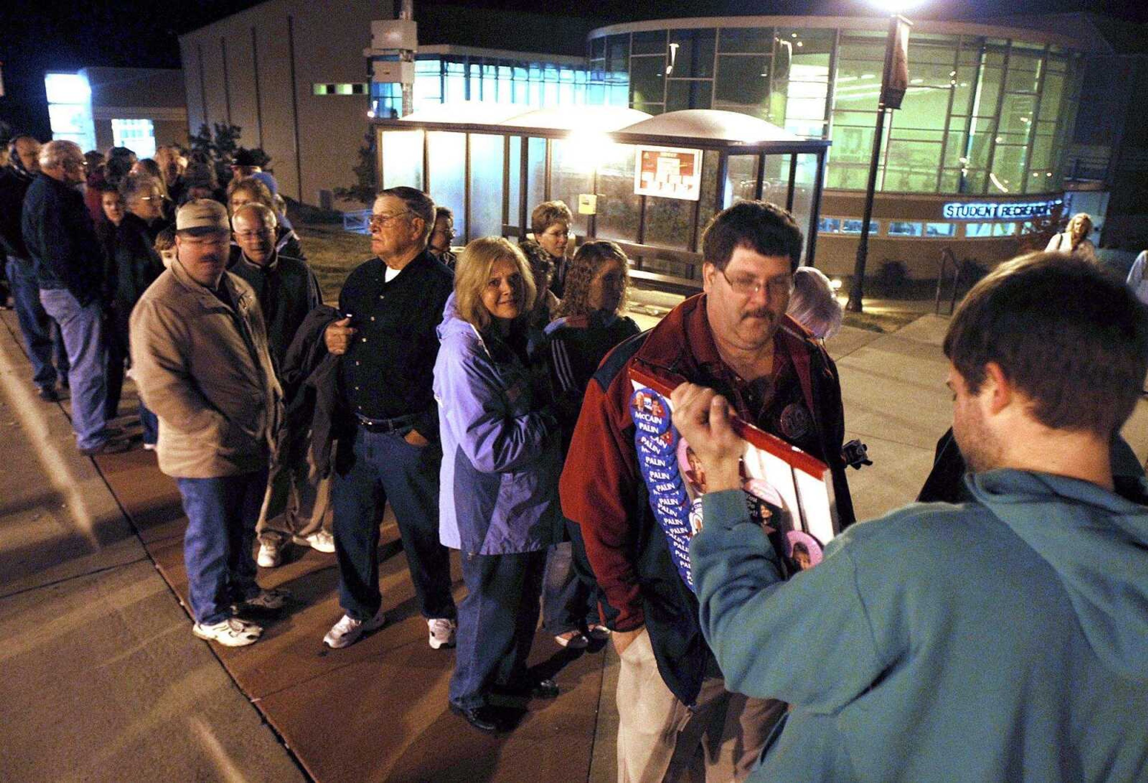 FRED LYNCH ~ flynch@semissourian.com
A button seller works the line of people which stretched back to the Student Recreation Center before doors opened at 6:30 a.m..