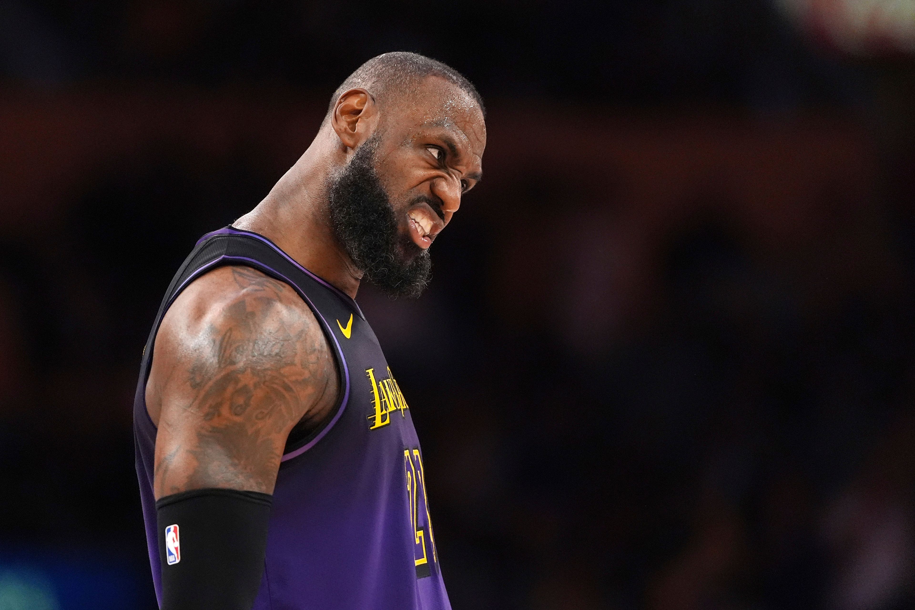 Los Angeles Lakers forward LeBron James reacts after scoring during the second half of an NBA basketball game against the Orlando Magic, Thursday, Nov. 21, 2024, in Los Angeles. (AP Photo/Mark J. Terrill)