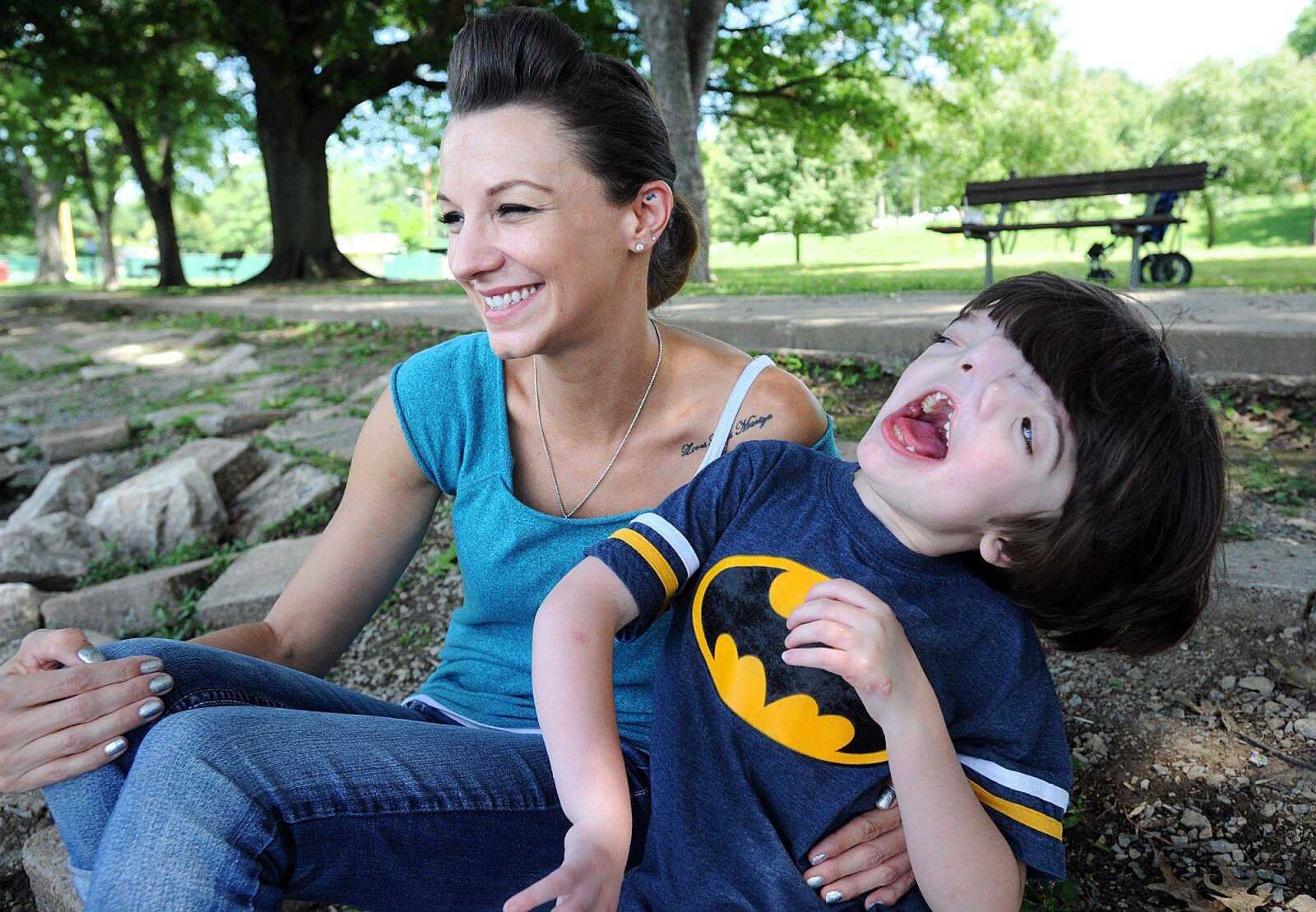 Brandy Johnson and her son, Tres, 10, share a laugh as they watch the ducks in the lagoon at Capaha Park on Thursday in Cape Girardeau. (Laura Simon)