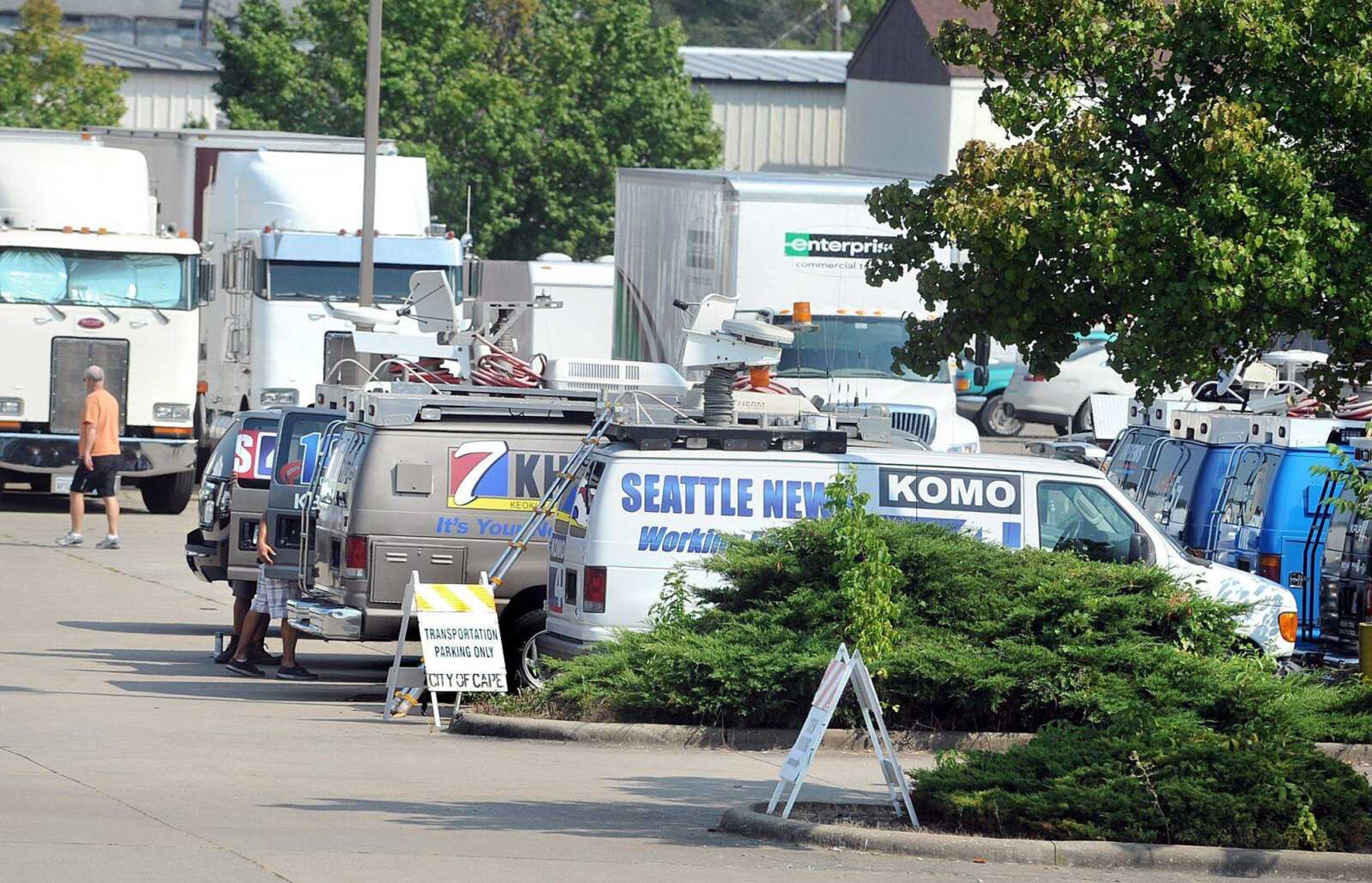 The parking lot next to Tipton Linen and Custom Matting on Independence Street is bustling with trucks, cars, vans and trailers for the 20th Century Fox film &#8220;Gone Girl&#8221; Monday afternoon. (Laura Simon)