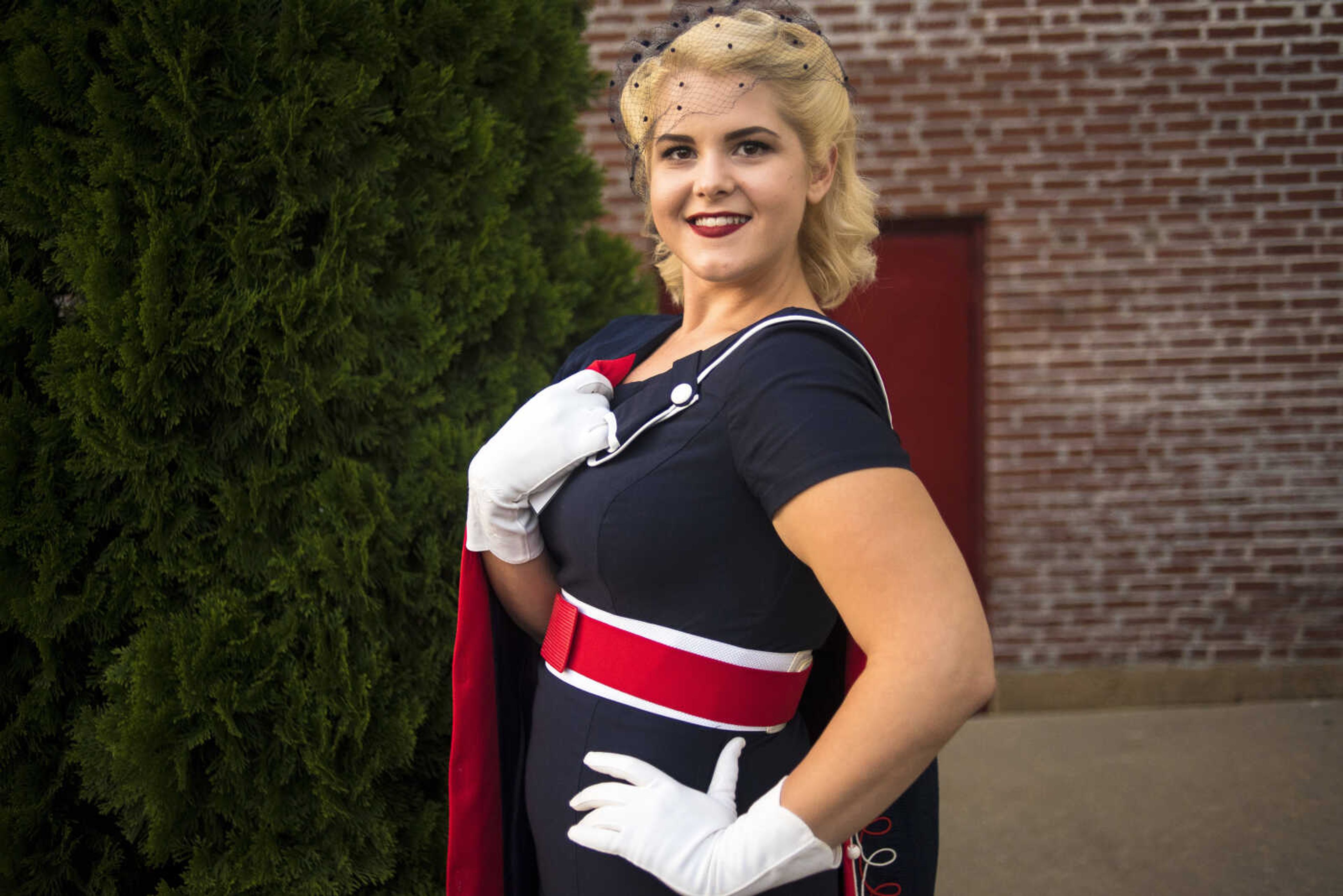 Amber Spies poses for a photo after winning the pinup professional contest Saturday, Sept. 2, 2017 in downtown Perryville.