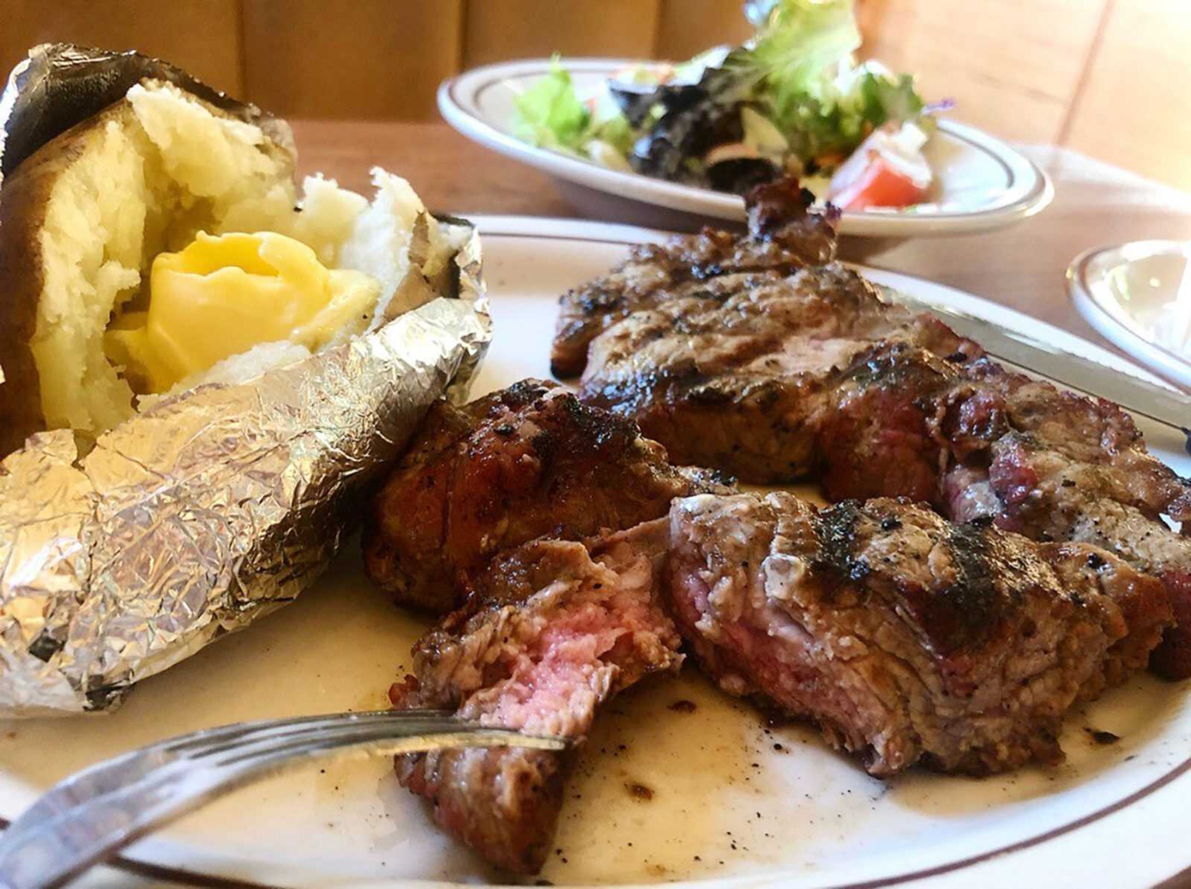 Steak, baked potato and salad at Grecian Steak House in Cape Girardeau.