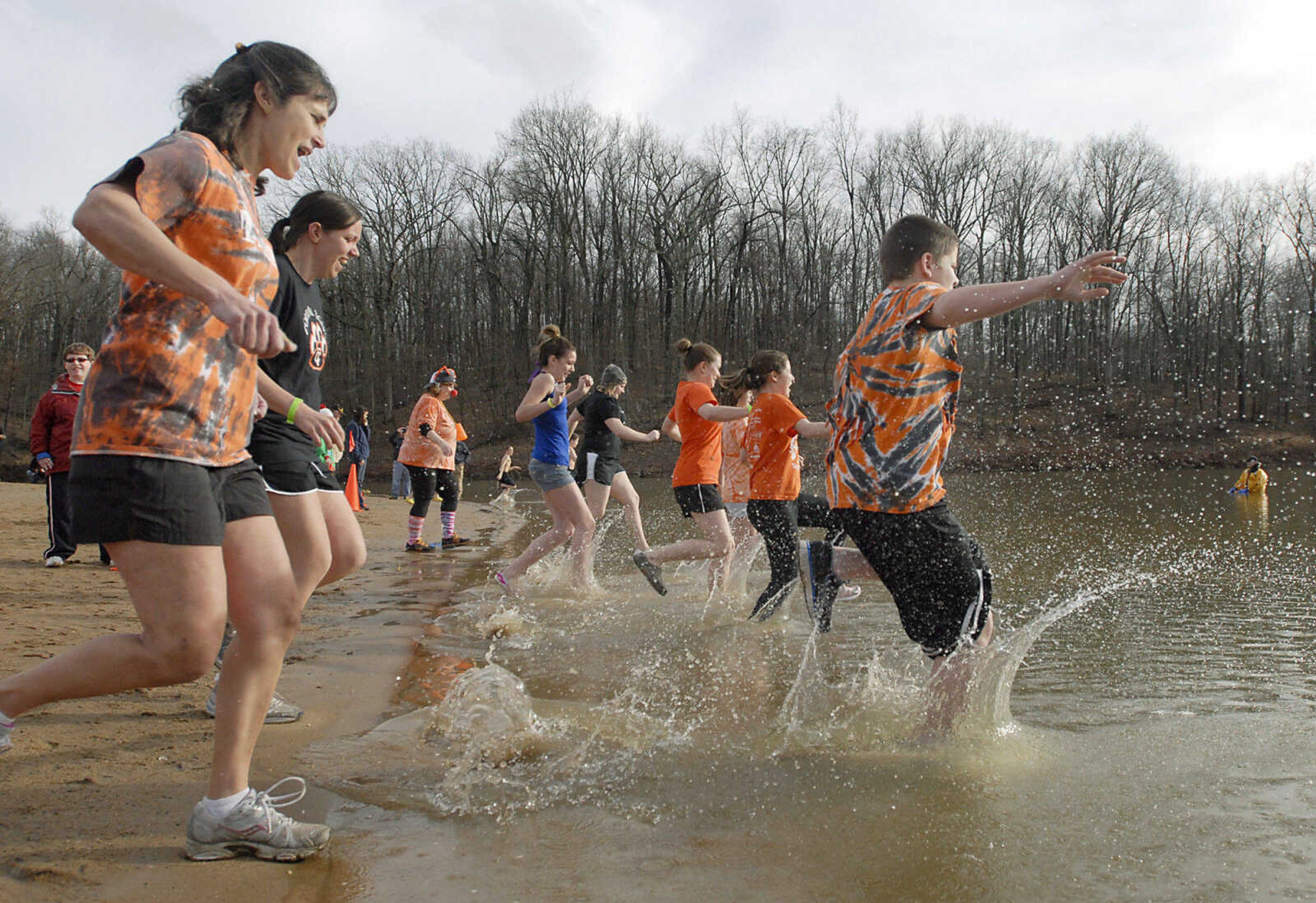 KRISTIN EBERTS ~ keberts@semissourian.com

Members of the Kiwanis K-Kids of Cape Central Middle School kick up a splash as they enter the water during the 2012 Polar Plunge at the Trail of Tears State Park's Lake Boutin on Saturday, Feb. 4, 2012.