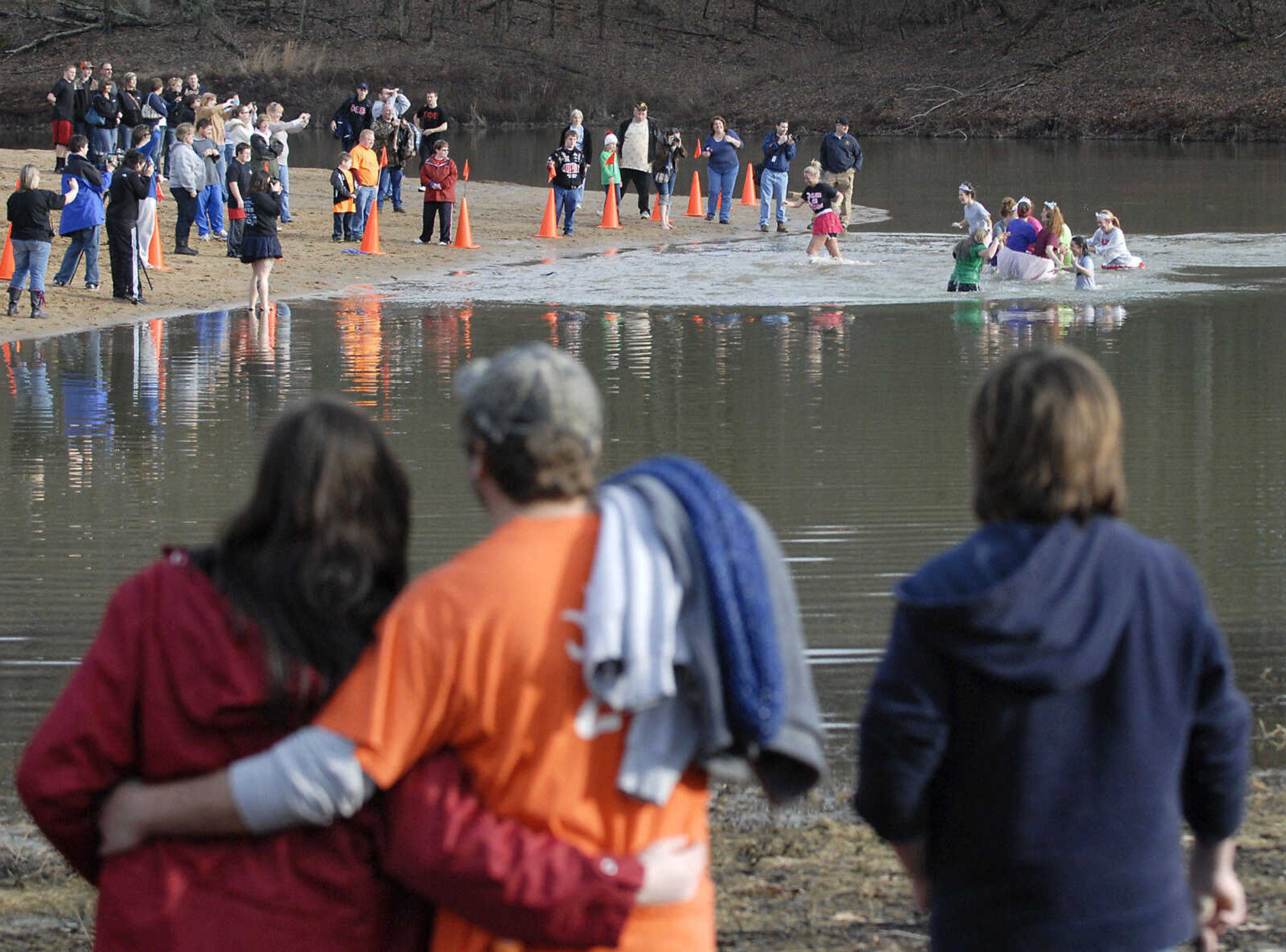 KRISTIN EBERTS ~ keberts@semissourian.com

Spectators watch from dry ground as teams brave the water during the 2012 Polar Plunge at the Trail of Tears State Park's Lake Boutin on Saturday, Feb. 4, 2012.