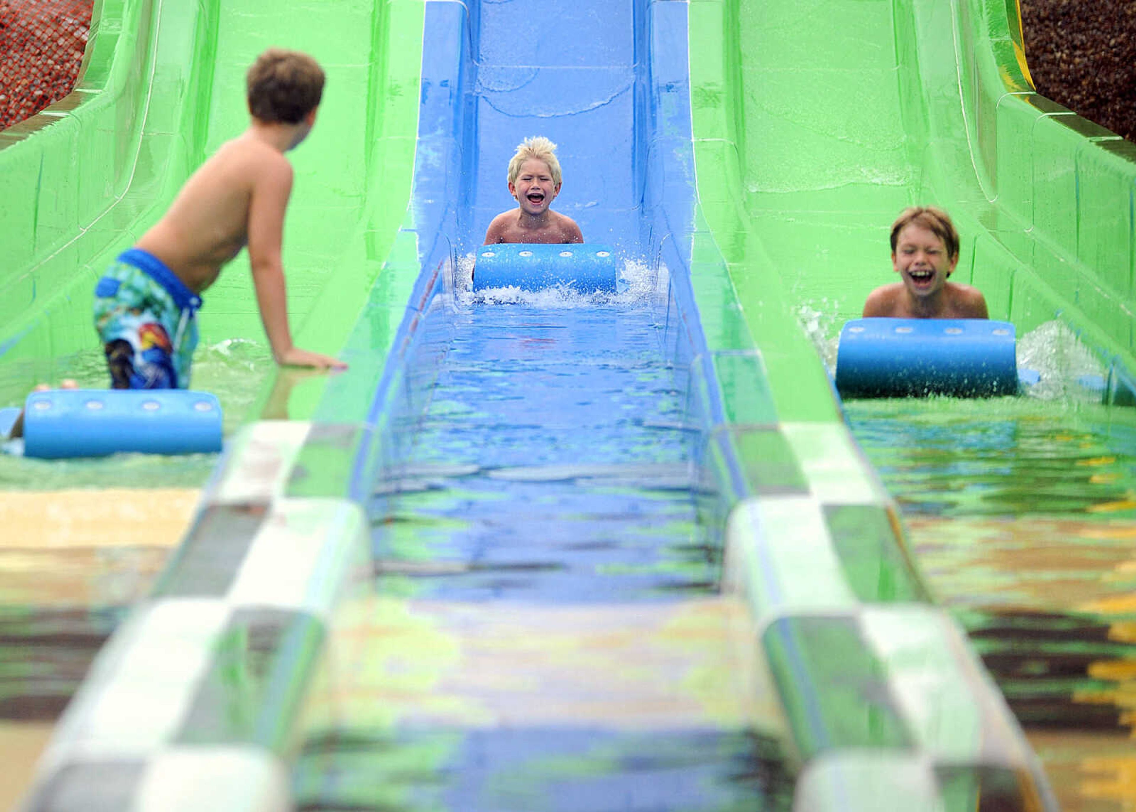 LAURA SIMON ~ lsimon@semissourian.com

The Cape Girardeau Parks and Recreation Department opened the new 265-foot-long free-fall slide, 259-foot-long triple-drop slide and a three-Lane 319-foot-long mat racer with 30-foot tower, at Cape Splash Family Aquatic Center, Thursday, July 9, 2015.