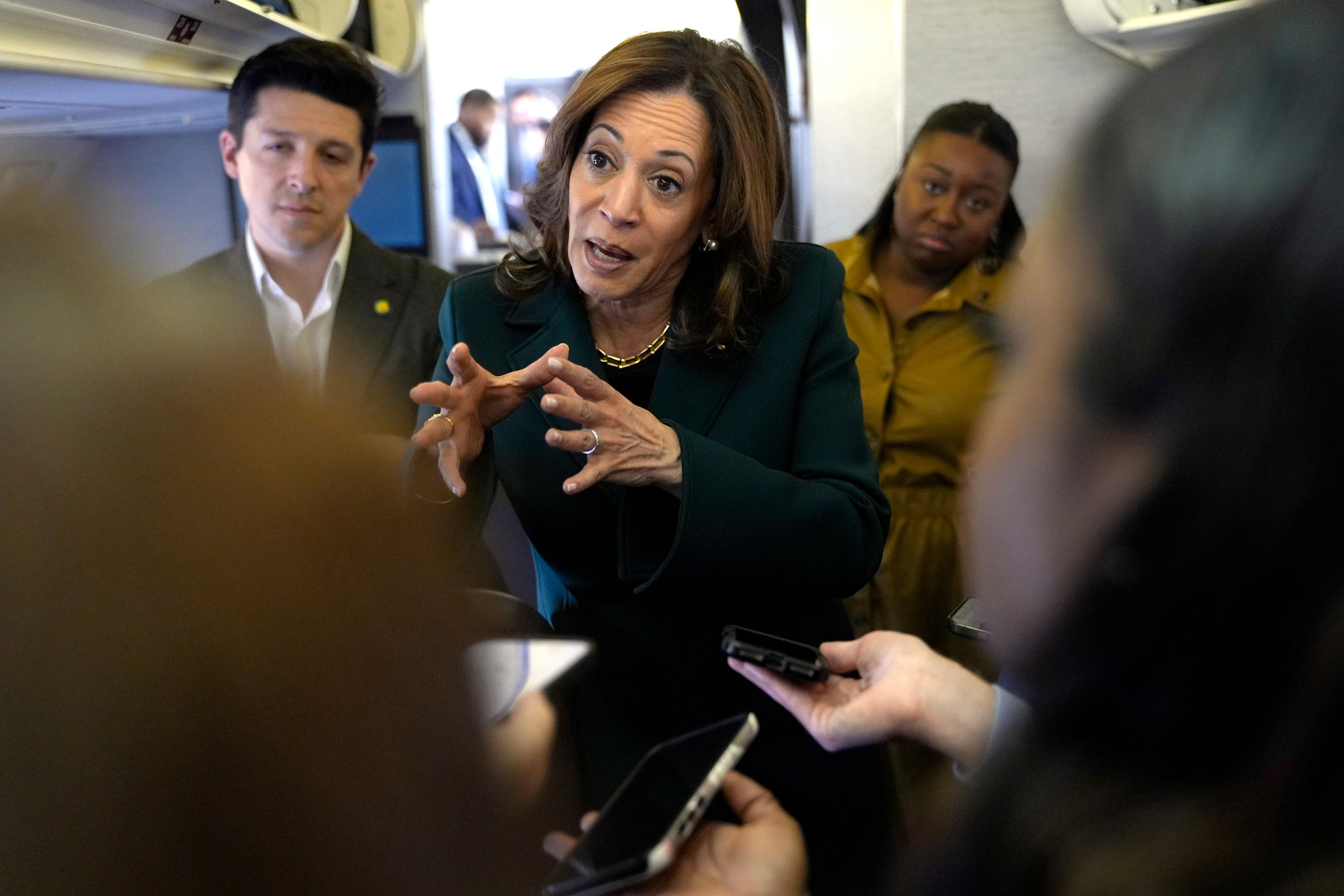 Democratic presidential nominee Vice President Kamala Harris speaks with members of the press on board Air Force Two at Philadelphia International Airport, Monday, Oct. 21, 2024, in Philadelphia, before departing to Michigan. (AP Photo/Jacquelyn Martin, Pool)