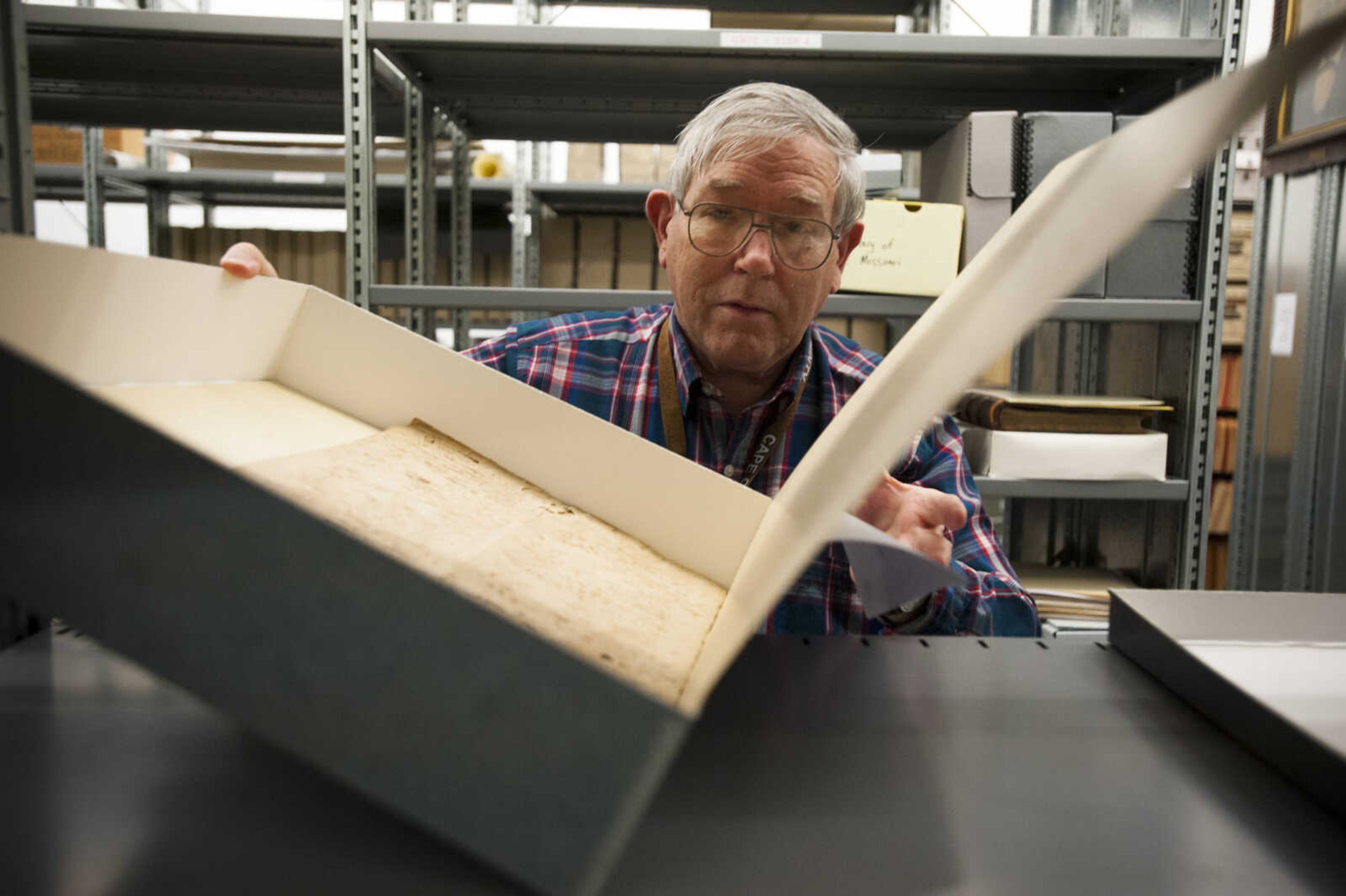 Documents written by Louis Lorimier are handled by assistant archivist Lyle Johnston on Thursday, March 8, 2018, at the Cape Girardeau County Archive Center in Jackson.