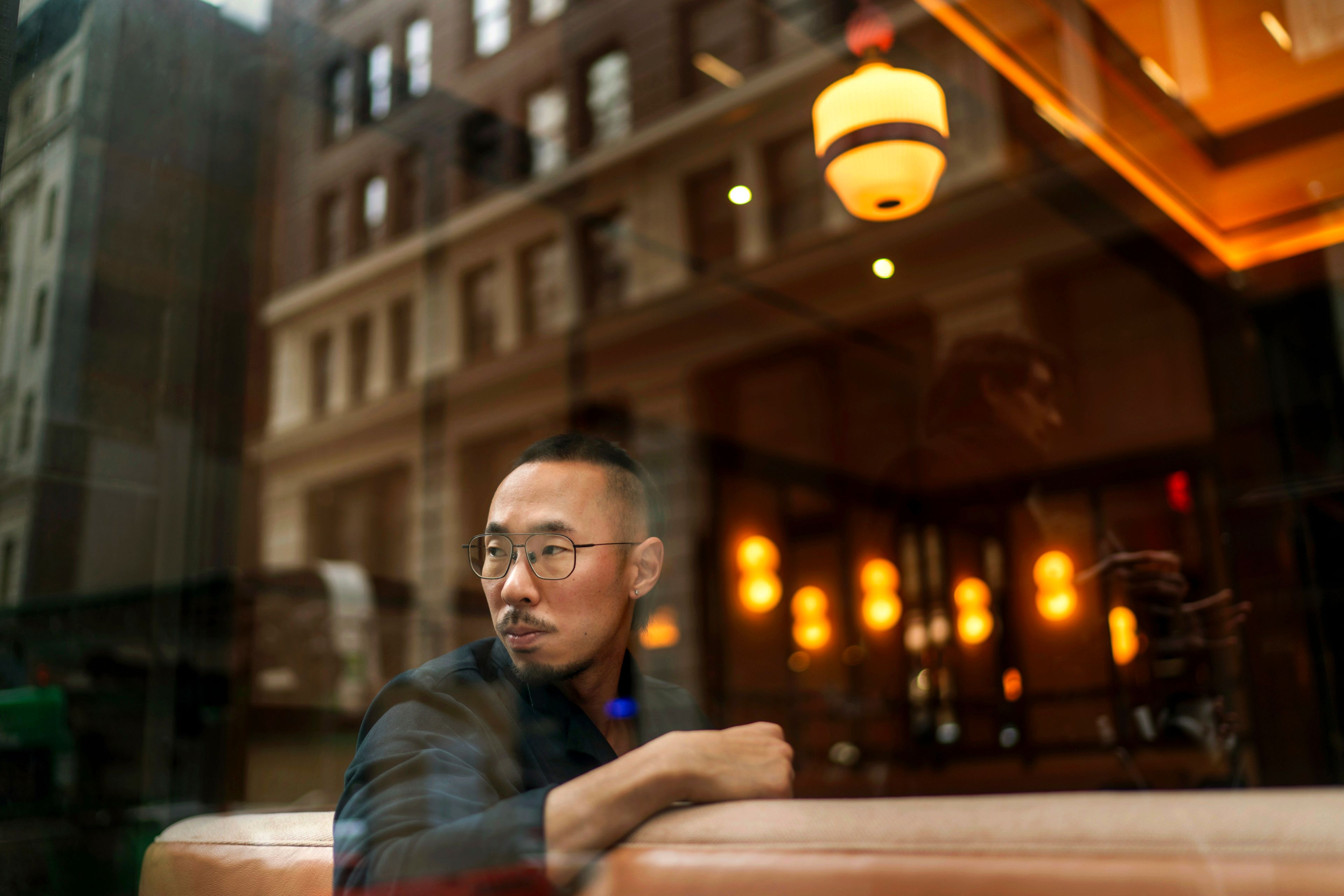 Robert Calabretta sits for a portrait at the restaurant where he works, Thursday, Feb. 15, 2024, in New York. (AP Photo/David Goldman)