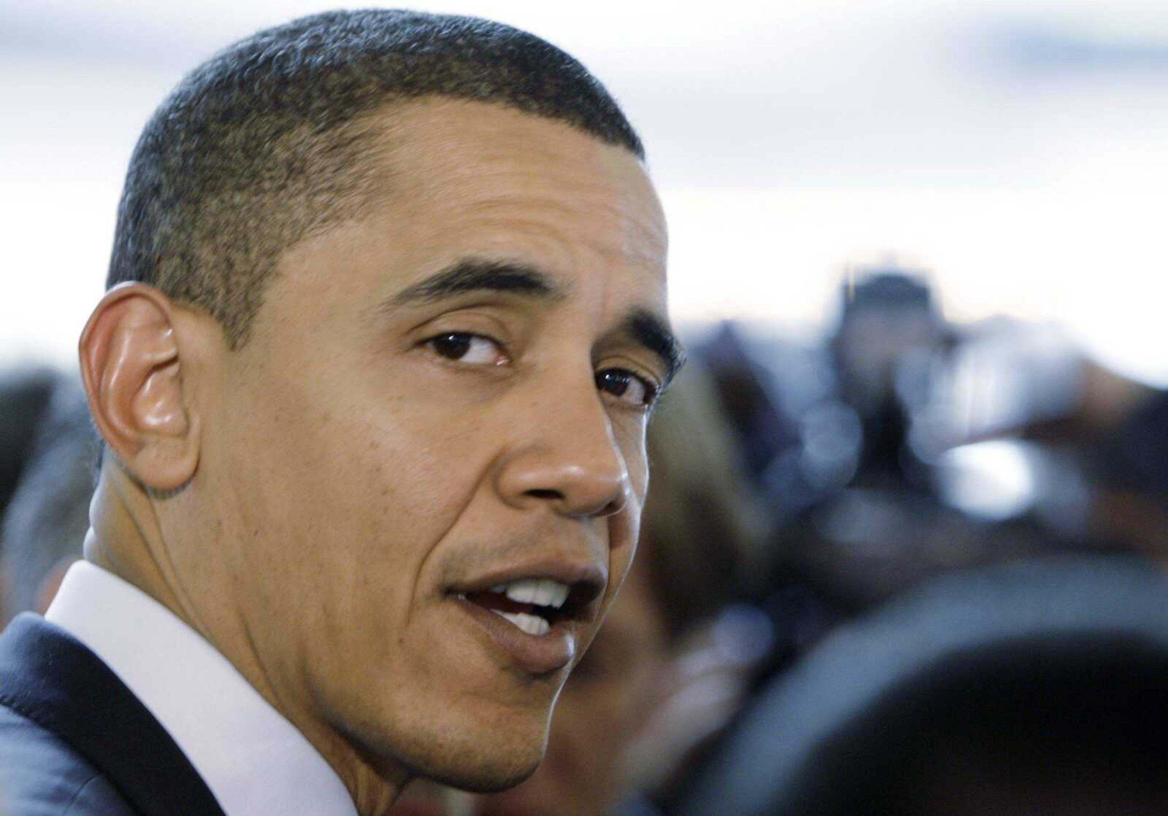 Democratic presidential hopeful, Sen. Barack Obama D-Ill., greets diners at a food court on caucus day Thursday, Jan. 3, 2008, in Des Moines, Iowa. (AP Photo/M. Spencer Green)