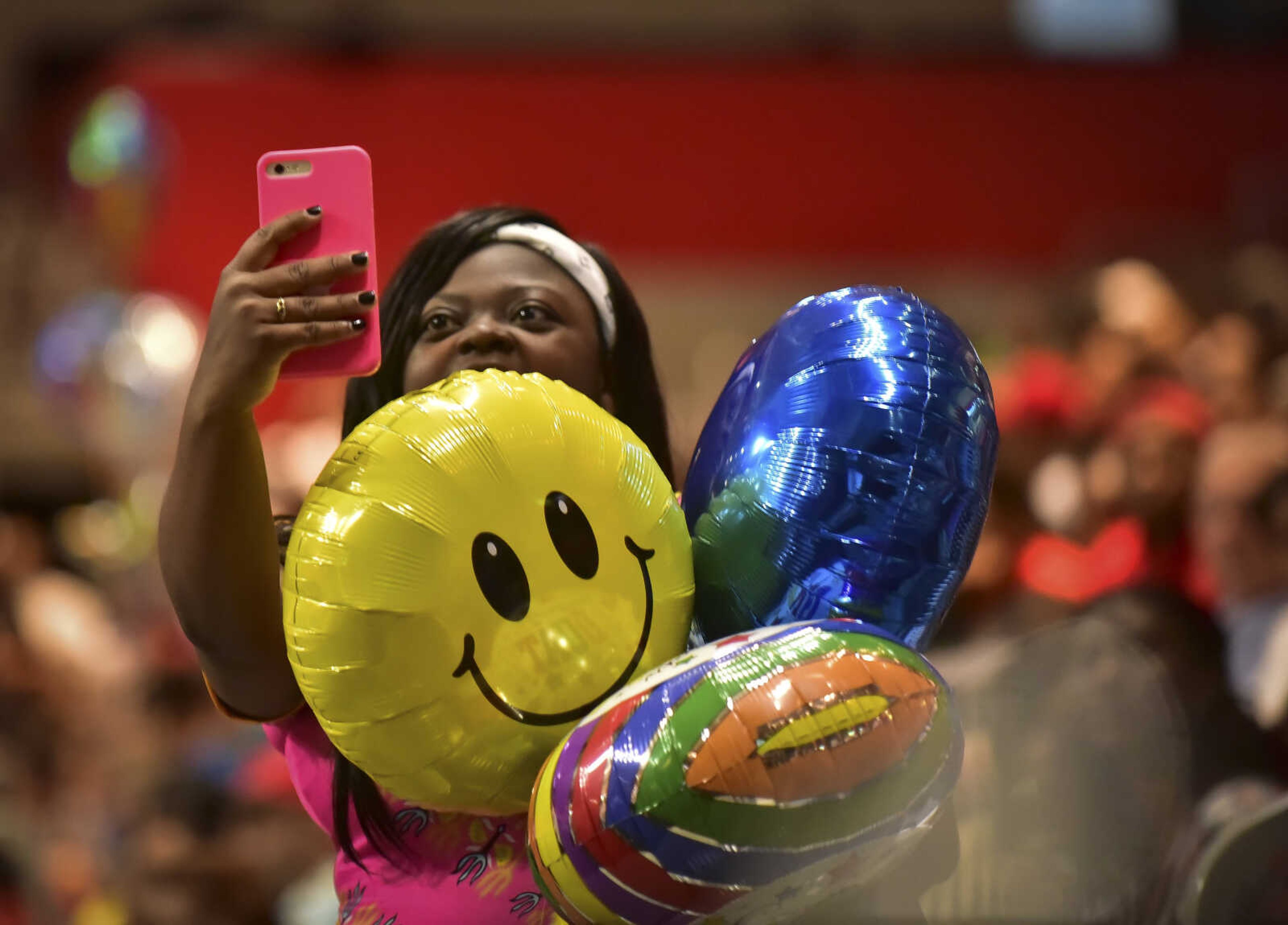 An audience member takes a photo during Cape Girardeau Central High School graduation Sunday, May 14, 2017at the Show Me Center in Cape Girardeau.