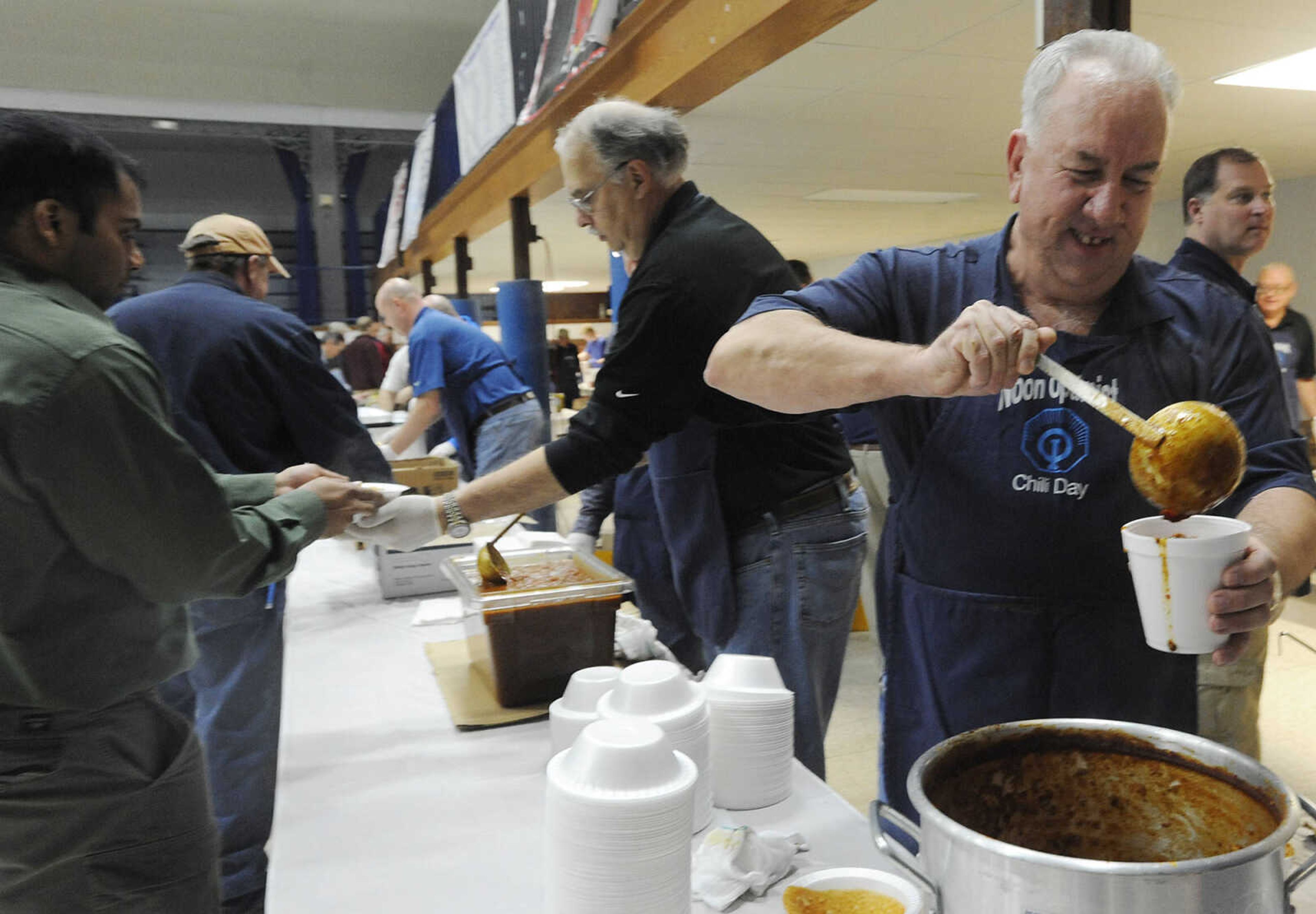 Noon Optimist member Gary Turner of Jackson, ladles out a container of chili at the Noon Optimist Chili Day Wednesday, March 6, at the A.C. Brase Arena Building in Cape Girardeau. The service club used 540 lbs., of meat to make 440 gallons of chili that was served alongside 2,000 hot dogs at the annual fundraiser. Proceeds from the event go to fund the group's service projects.