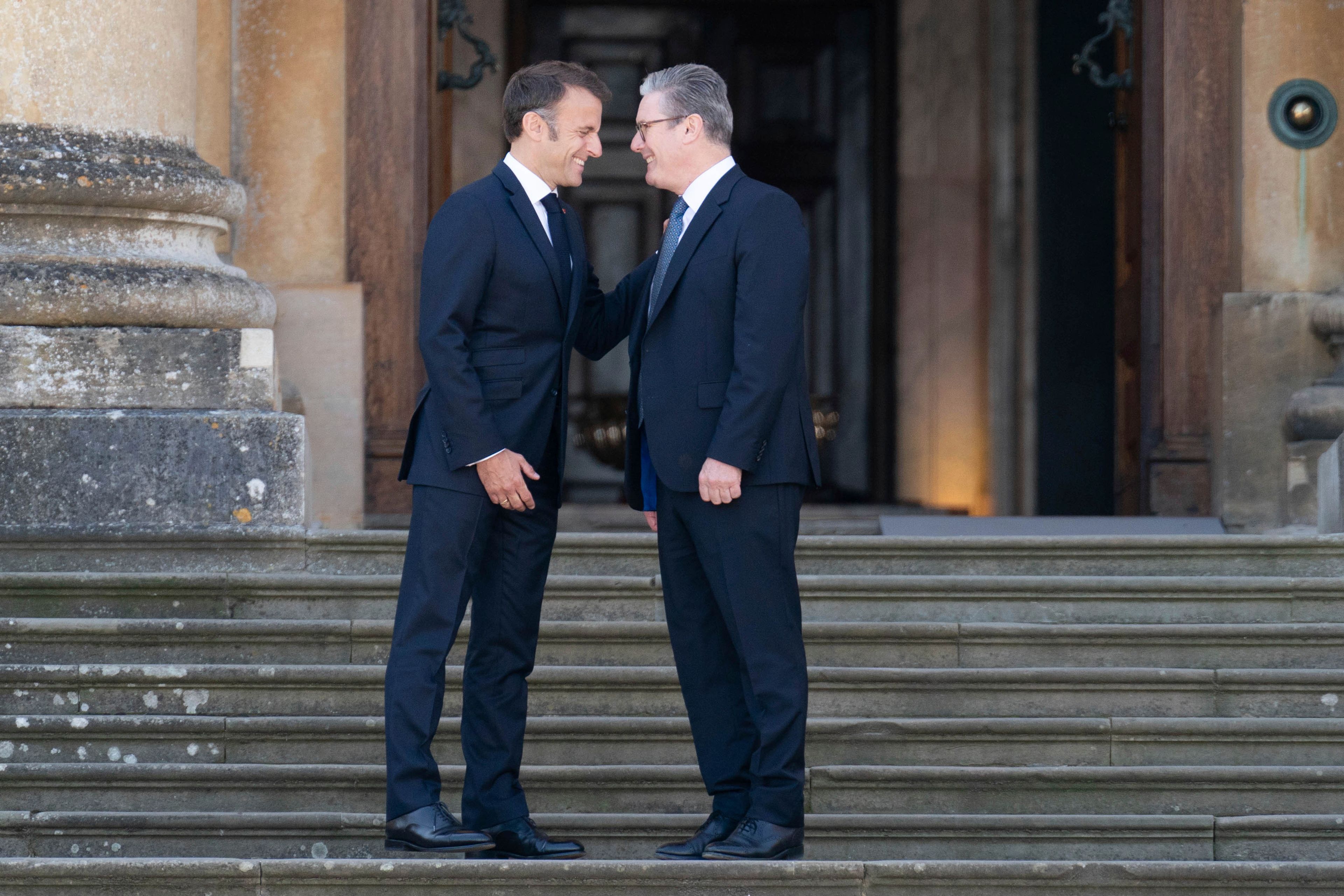 FILE - French President Emmanuel Macron, left, is welcomed by British Prime Minister Keir Starmer to the European Political Community summit at Blenheim Palace in Woodstock, Oxfordshire, England, Thursday July 18, 2024. (Stefan Rousseau/PA via AP, Pool, File)