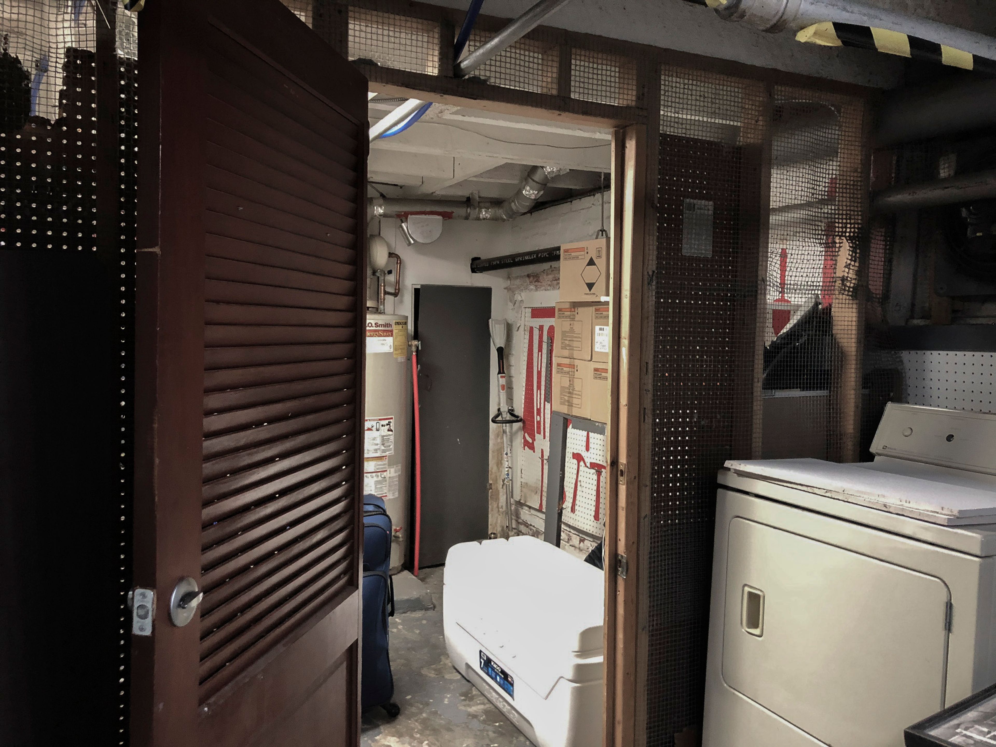 This June 13, 2024 photo shows a doorway leading to what was known as "the cage" in the basement of the Huntington Addiction Wellness Center, formerly the Huntington Work Release Center where April Youst was assigned as a prisoner in Huntington W. Va. (AP Photo/Margie Mason)