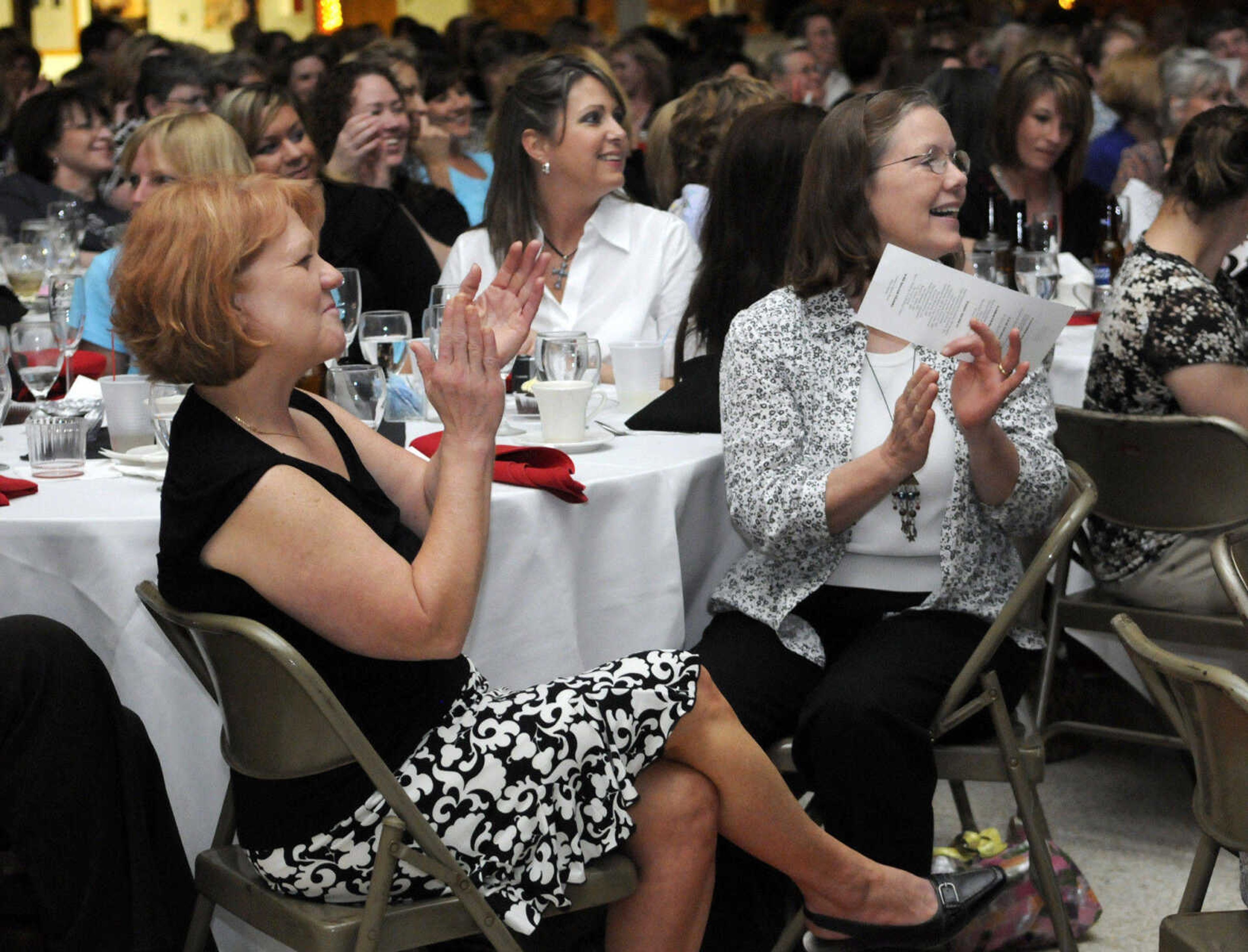 KRISTIN EBERTS ~ keberts@semissourian.com

Evelyn Mills, left, and Sarah Goodin, nurses in the Surgical Progressive Care Unit at Southeast Missouri Hospital applaud during the 2010 Celebration of Nursing at A.C. Brase Arena in Cape Girardeau, Mo., on Wednesday, May 5. Over 400 area nurses attended the celebration. The night's theme was "Hollywood Salutes Nursing."