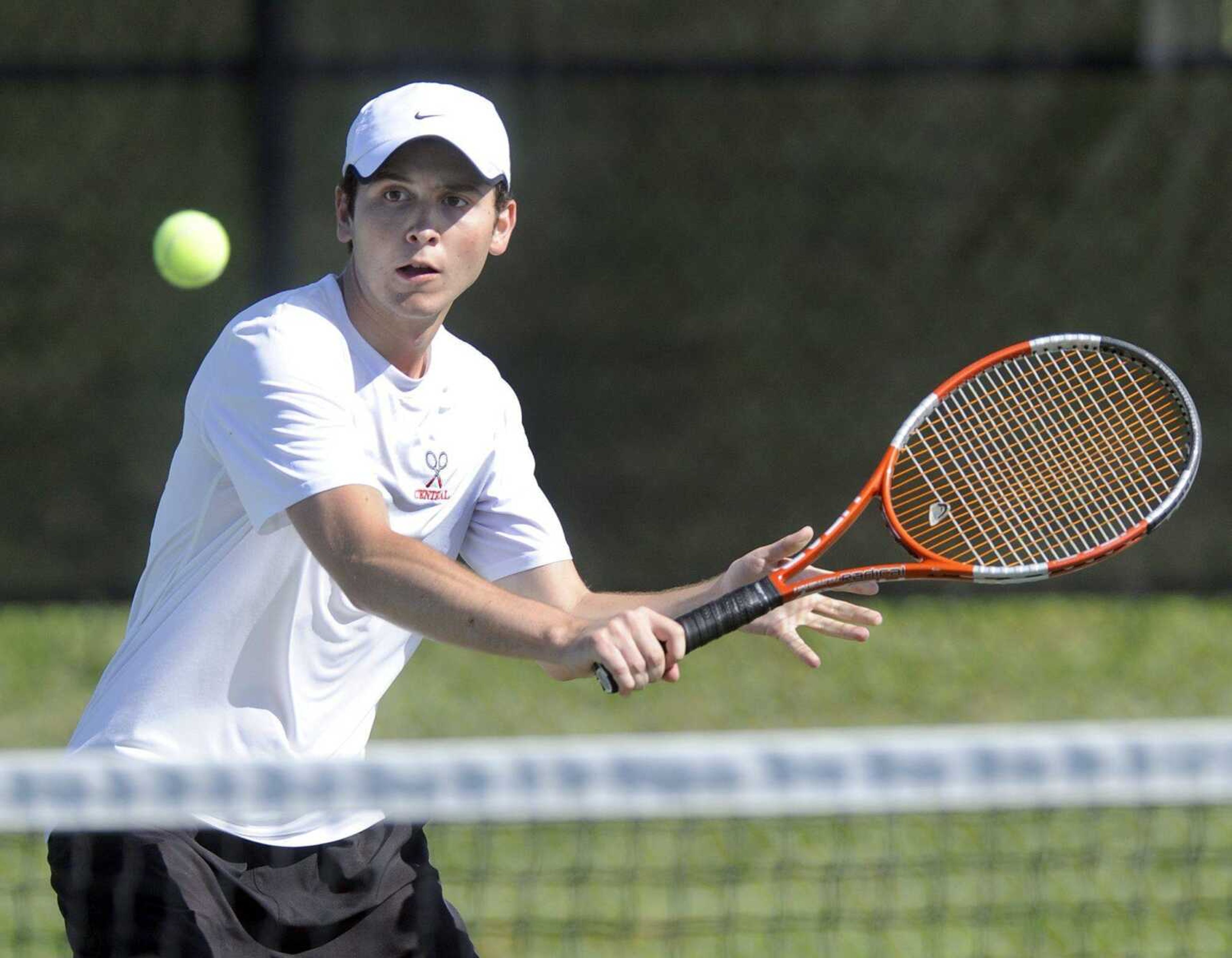 Central&#8217;s Ryan Watts returns a volley during his No. 2 singles match against Farmington&#8217;s Matt Kalinowski during the Class 2 District 1 semifinals Tuesday morning. The Tigers advanced to the finals with a 5-2 victory over the Knights.