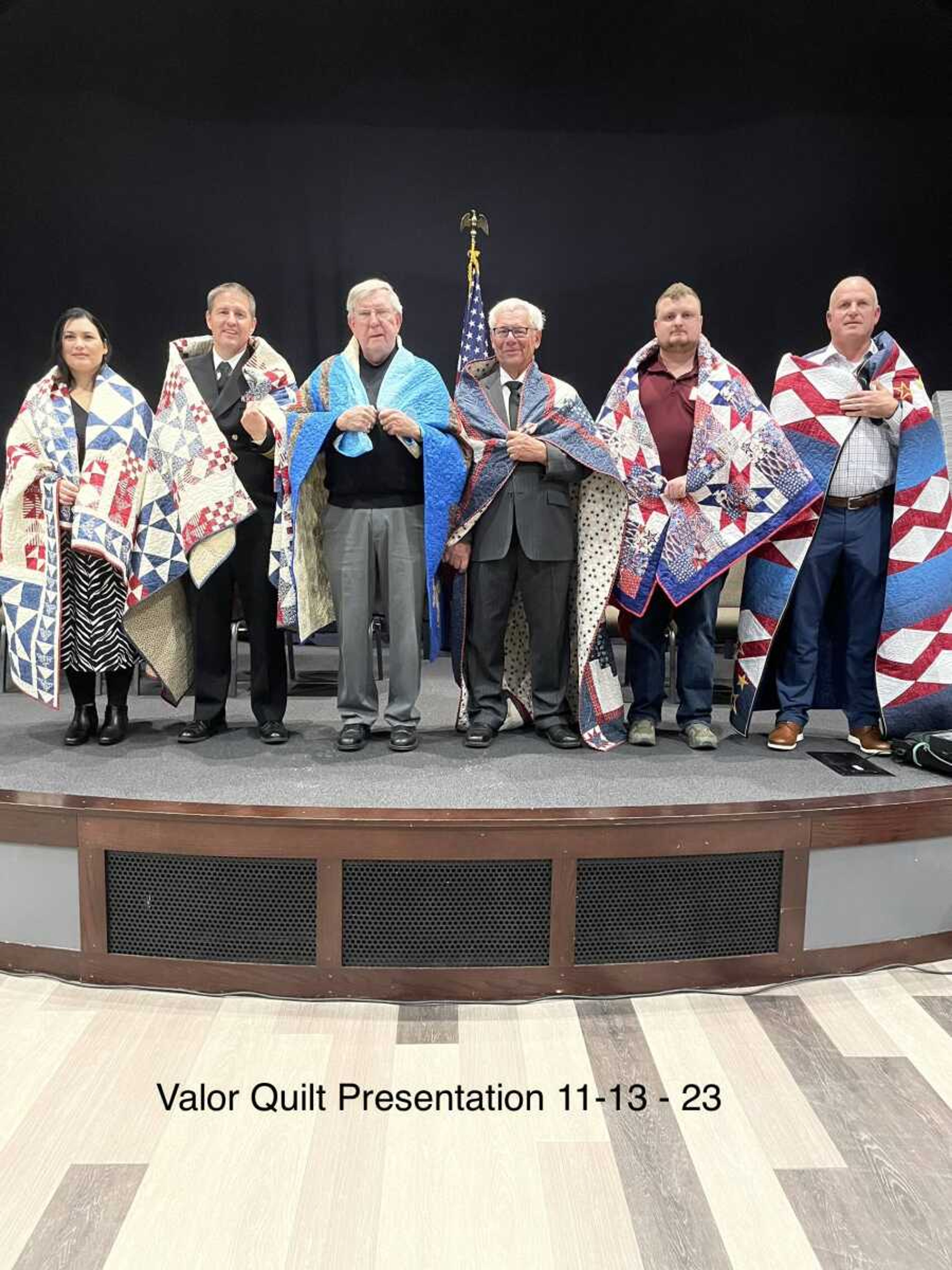 Left to right: Katrina Marietta, U.S.Air Force, quilt made and presented by Anne Marietta; Robert Marietta, U.S. Navy, quilt made and presented by Anne Marietta; Hershel Miller, U.S. Army, quilt made by Barbara Miller and Mary Green, presented by Daphna Fiehler; Fred Vogt, U.S. Army, quilt made, and presented by Harriet Martin; Elijah Duckworth, U.S. Army, quilt made and presented by Debbie Morris; Aaron Wright, U.S. Marine Corps, quilt made and presented by Kathleen Wright. 