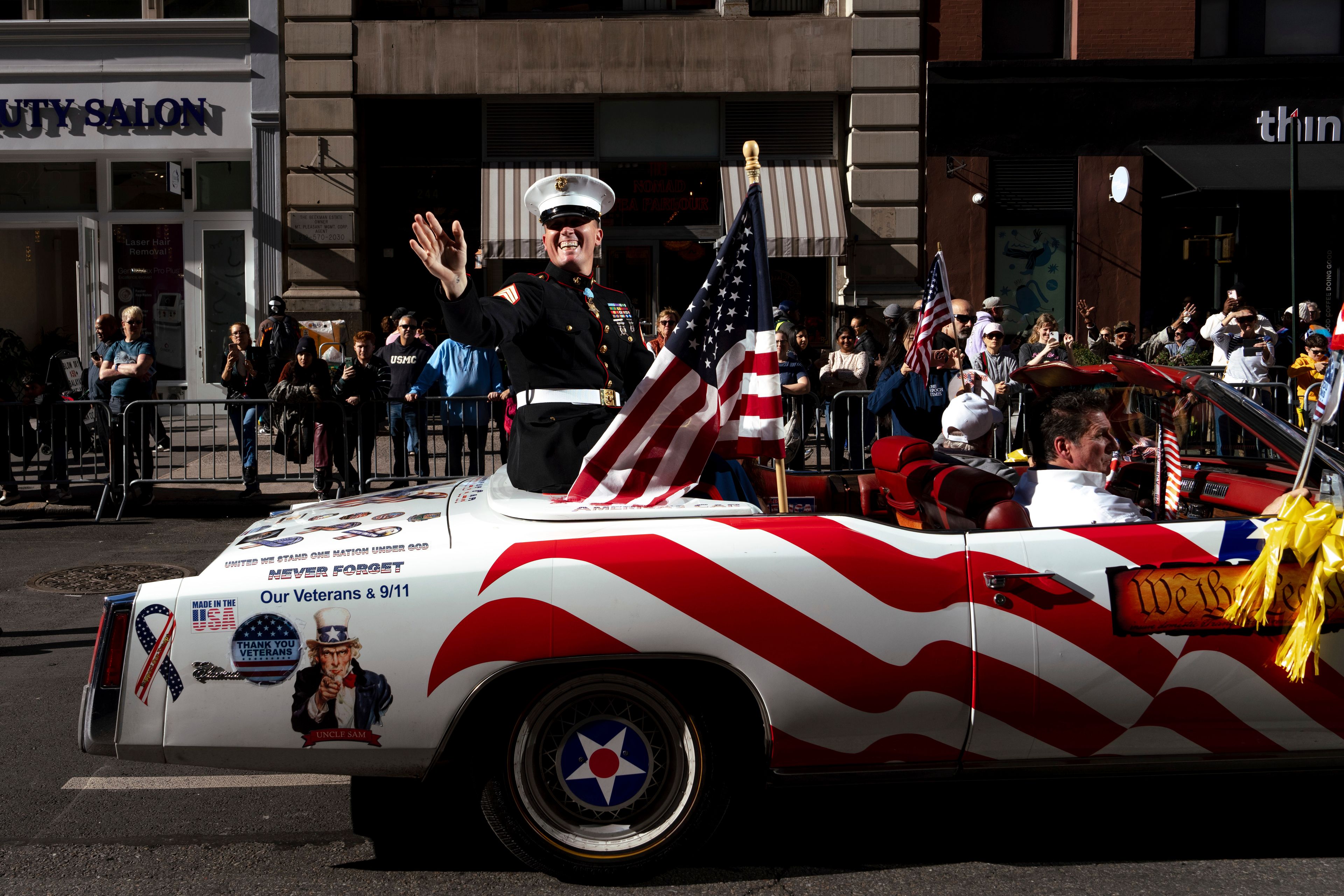 Grand Marshal Dakota Meyer, U.S. Marine Corps, a Medal of Honor recipient, waves from a car during the annual Veterans Day Parade, Monday, Nov. 11, 2024, in New York. (AP Photo/Adam Gray)