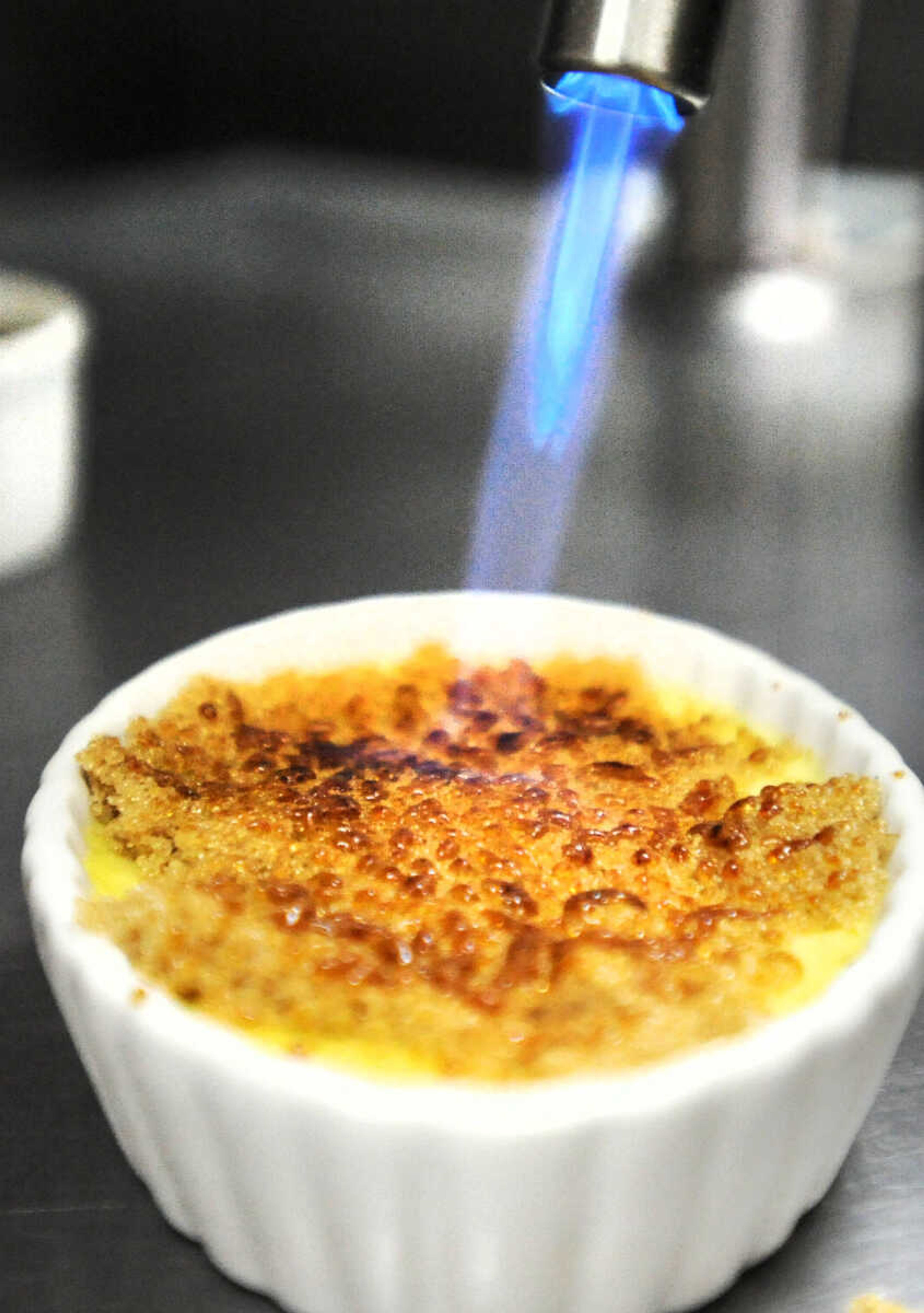 LAURA SIMON ~ lsimon@semissourian.com

Chef Cathy Brans caramelizes the sugar on the Creme BržlŽe in the kitchen of the Inn St. Gemme Beauvais, Sunday, March 23, 2015, in St. Genevieve.