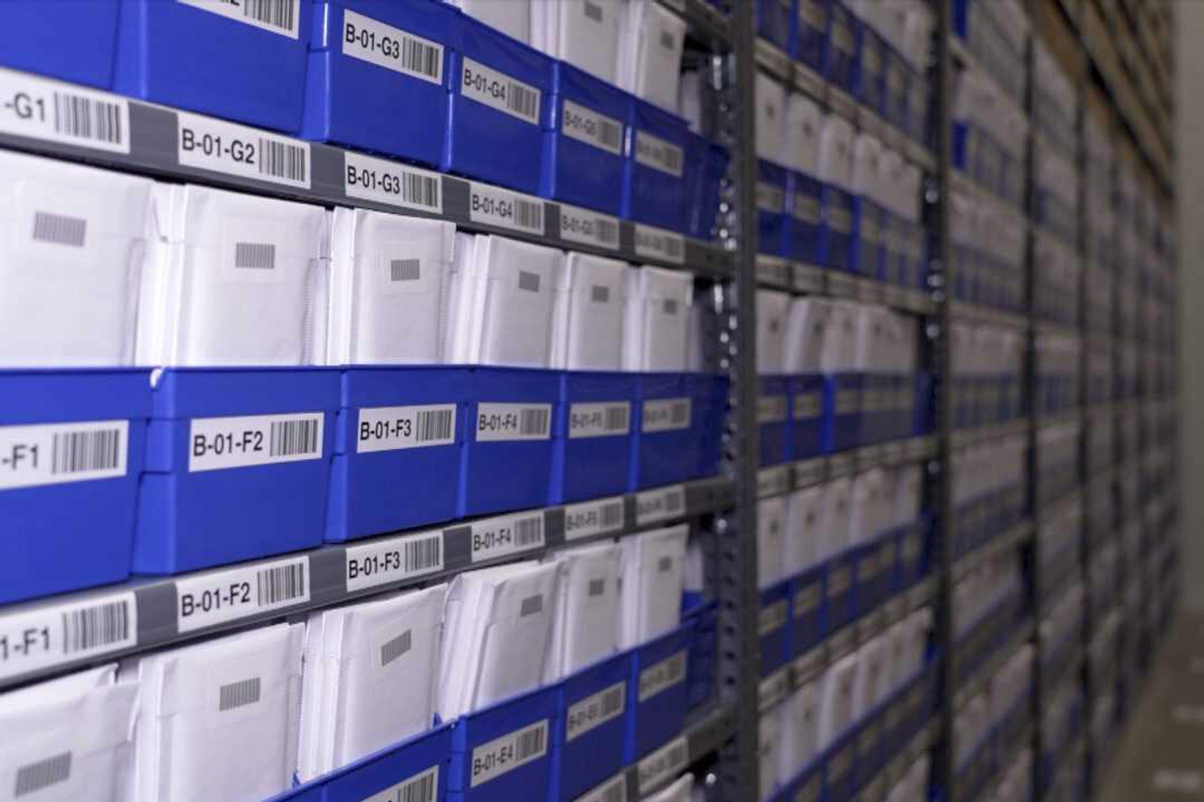 Stacks of collectibles fill shelves housed in a safe at Collectors Vault on Oct. 21 in Delaware. Inside the boxes are sports cards, baseball bats, Pokemon cards and other pricey memorabilia.