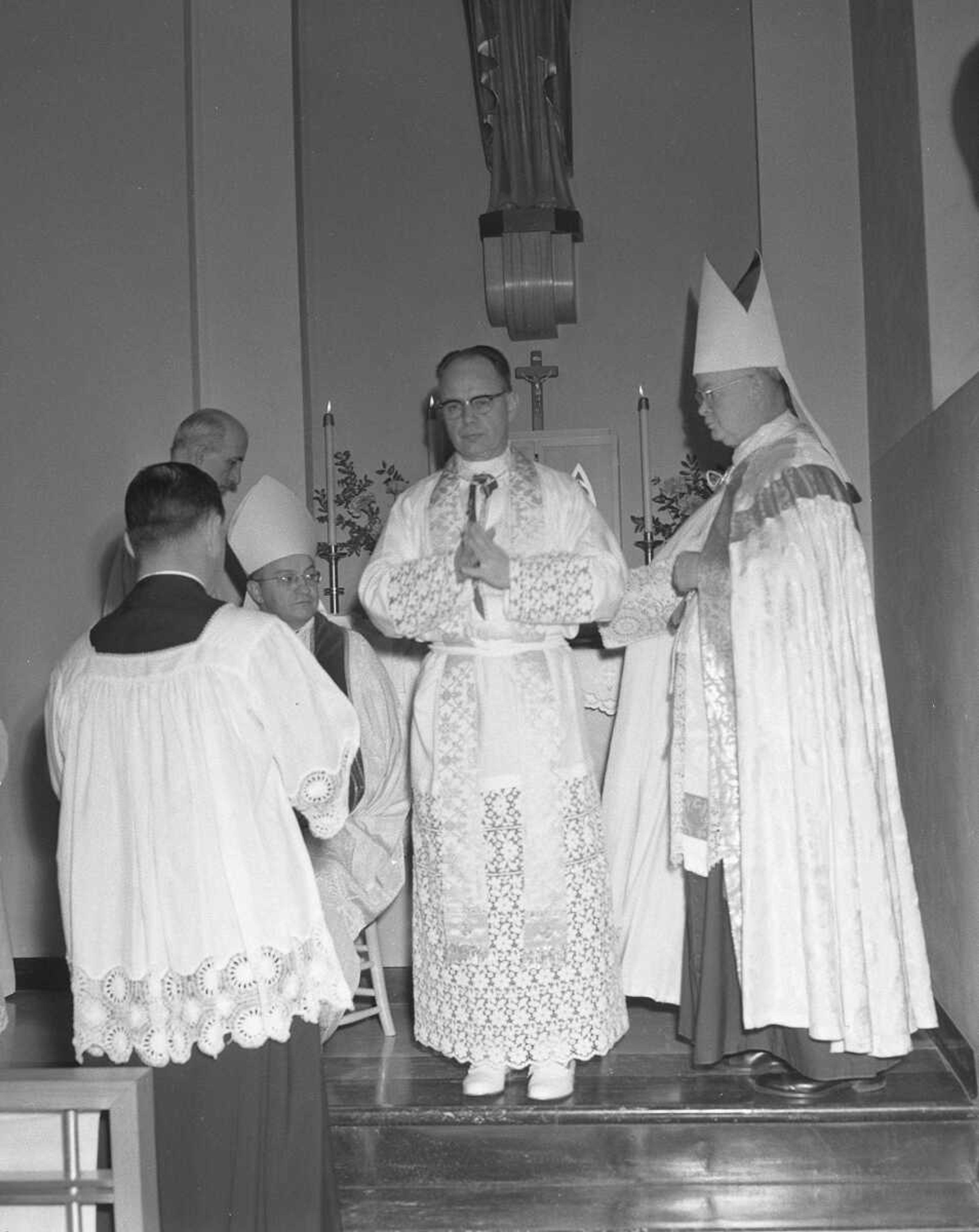 Bishop Marion Forst, former pastor of St. Mary's Cathedral, was dressed in the vestments of his new office on March 24, 1960. Bishop Leo Byrne, auxiliary bishop of St. Louis, was seated at left, and at right was Bishop Mark Carroll of the Wichita, Kan., Diocese.