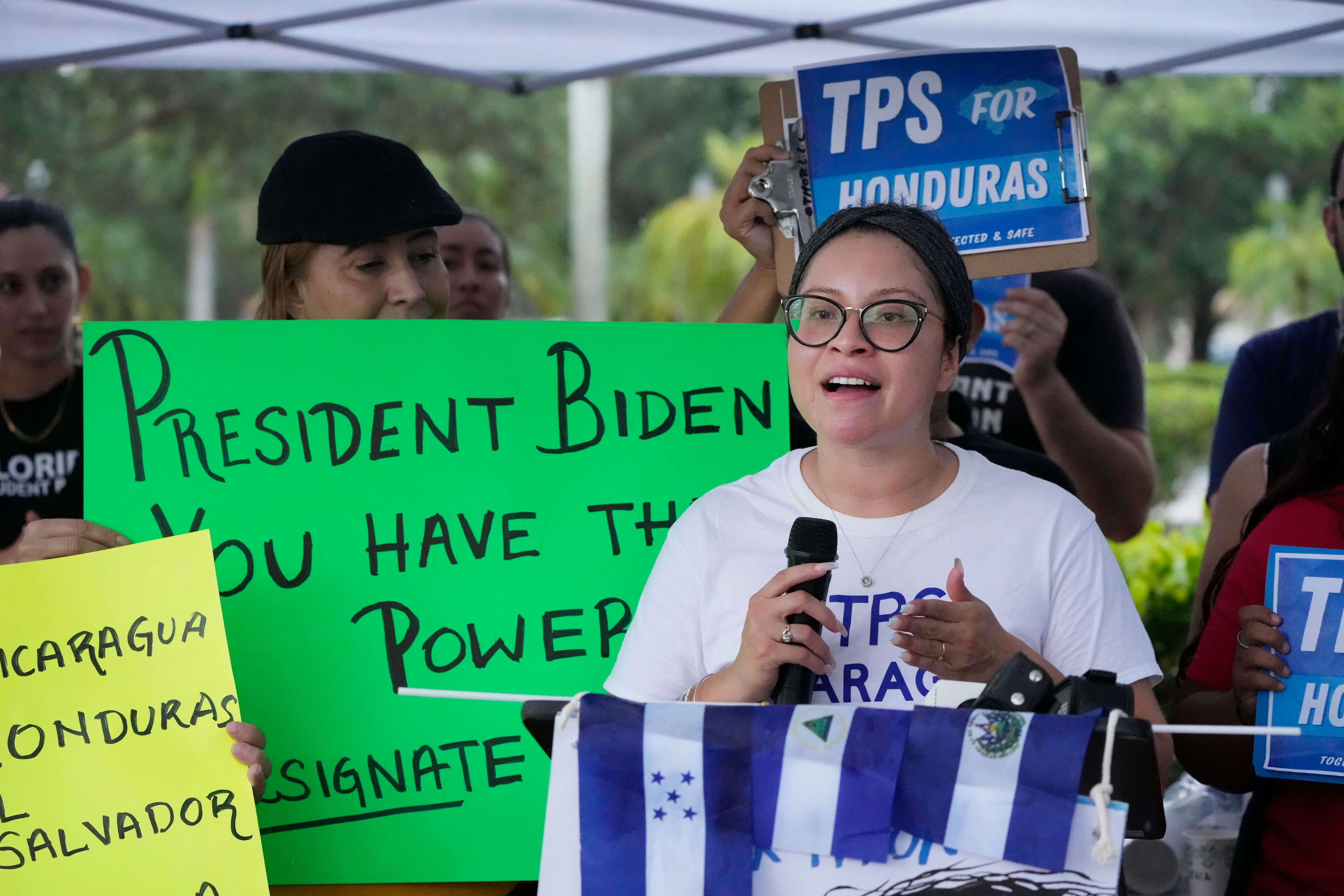 FILE - Yareliz Mendez, 29, with the Florida Immigrant Coalition, speaks during a news conference calling for a new designation of Temporary Protected Status (TPS) for migrants from Nicaragua, El Salvador, and Honduras, in front of the Immigration and Customs Enforcement (ICE) offices, Wednesday, July 26, 2023, in Miramar, Fla. (AP Photo/Wilfredo Lee, File)