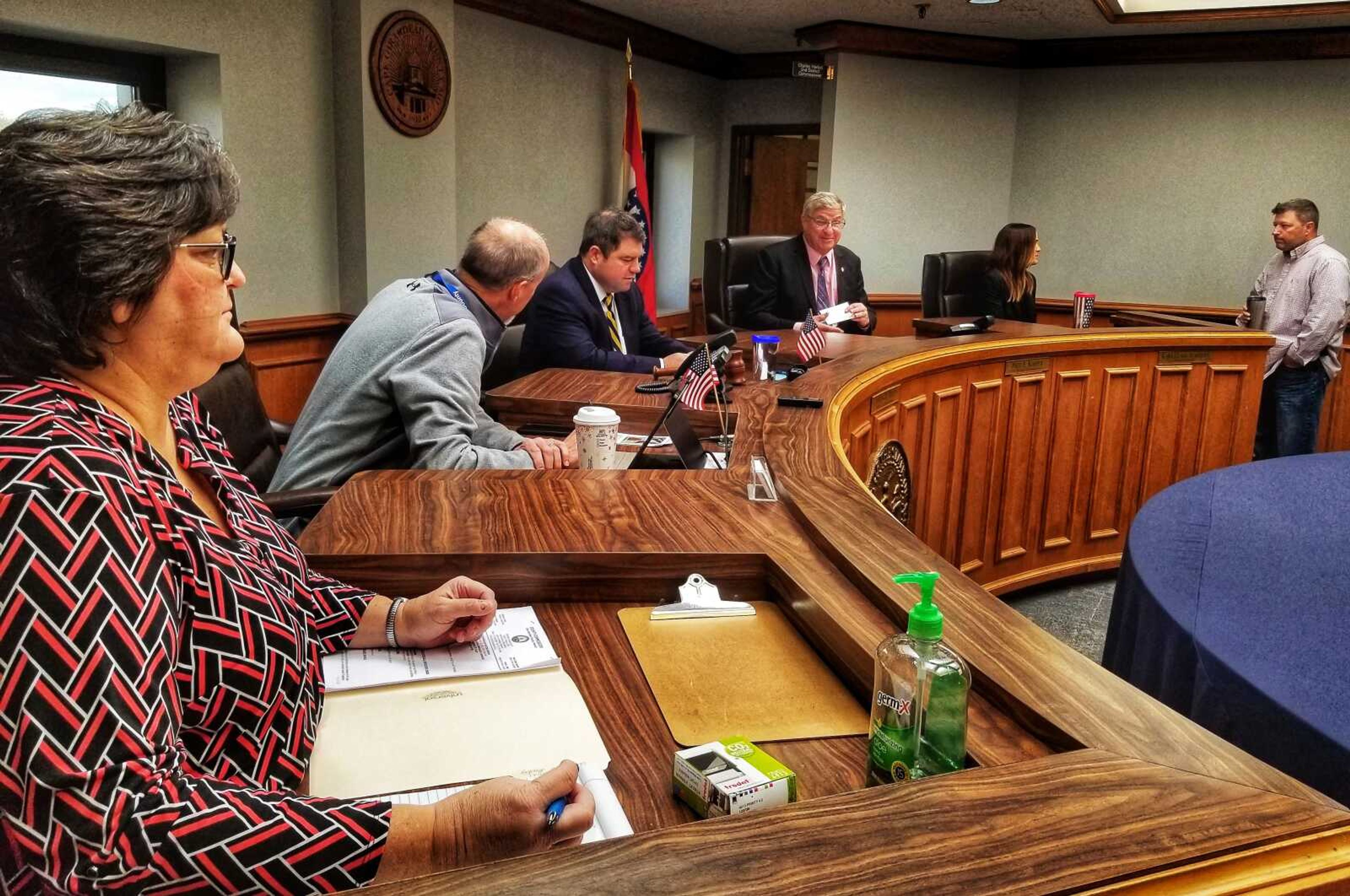 Officials prepare to start Thursday's meeting of the Cape Girardeau County Commission, from left to right, Kristi Nitsch, executive administrative assistant; Charlie Herbst, 2nd District Commissioner; Clint Tracy, Presiding Commissioner; Paul Koeper, 1st District Commissioner; Kara Clark Summers, county clerk/election authority; Pete Frazier, county auditor.