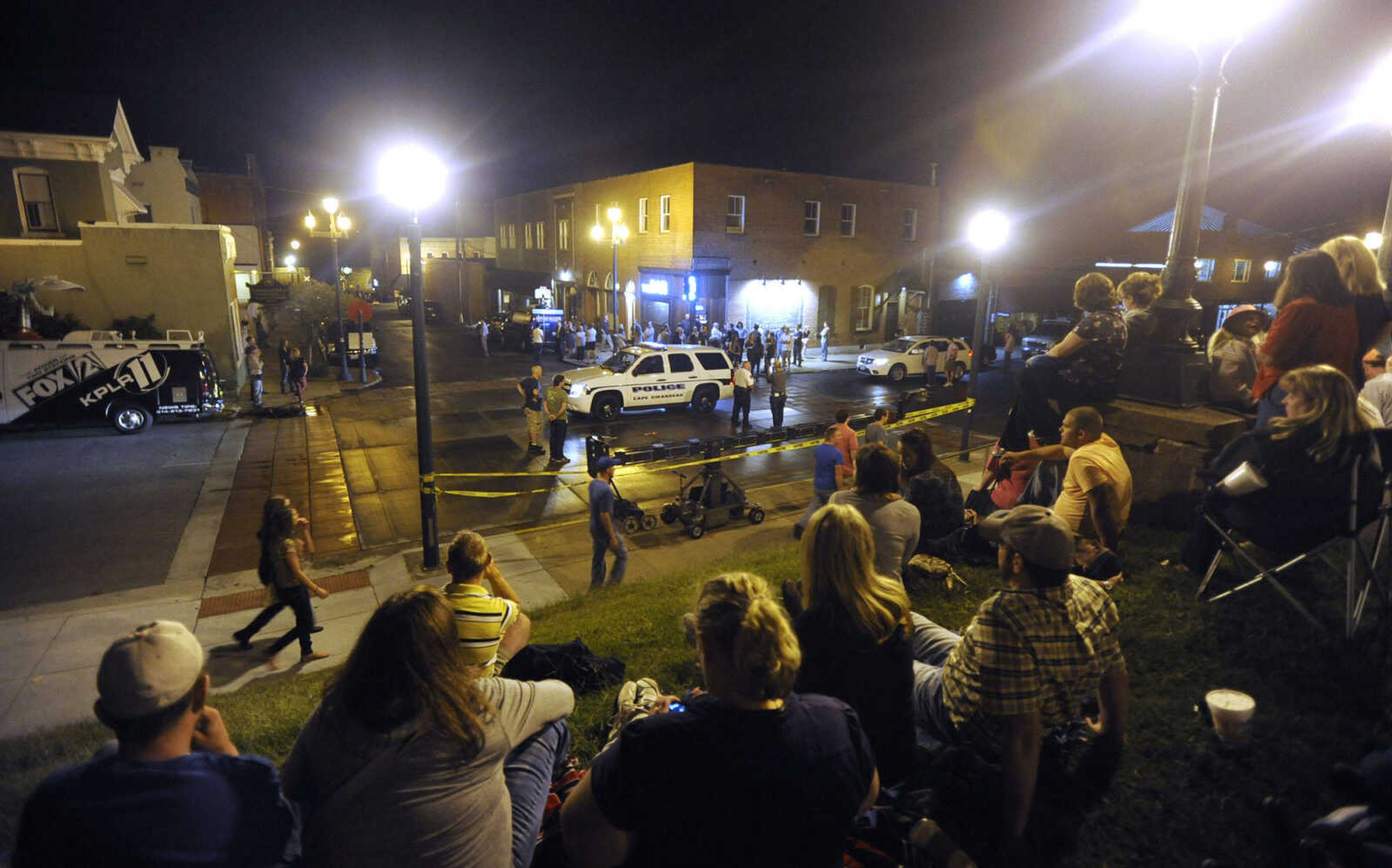 FRED LYNCH ~ flynch@semissourian.com
Spectators watch as the scene around The Bar is prepared for "Gone Girl" filming Friday, Sept. 27, 2013 in downtown Cape Girardeau.