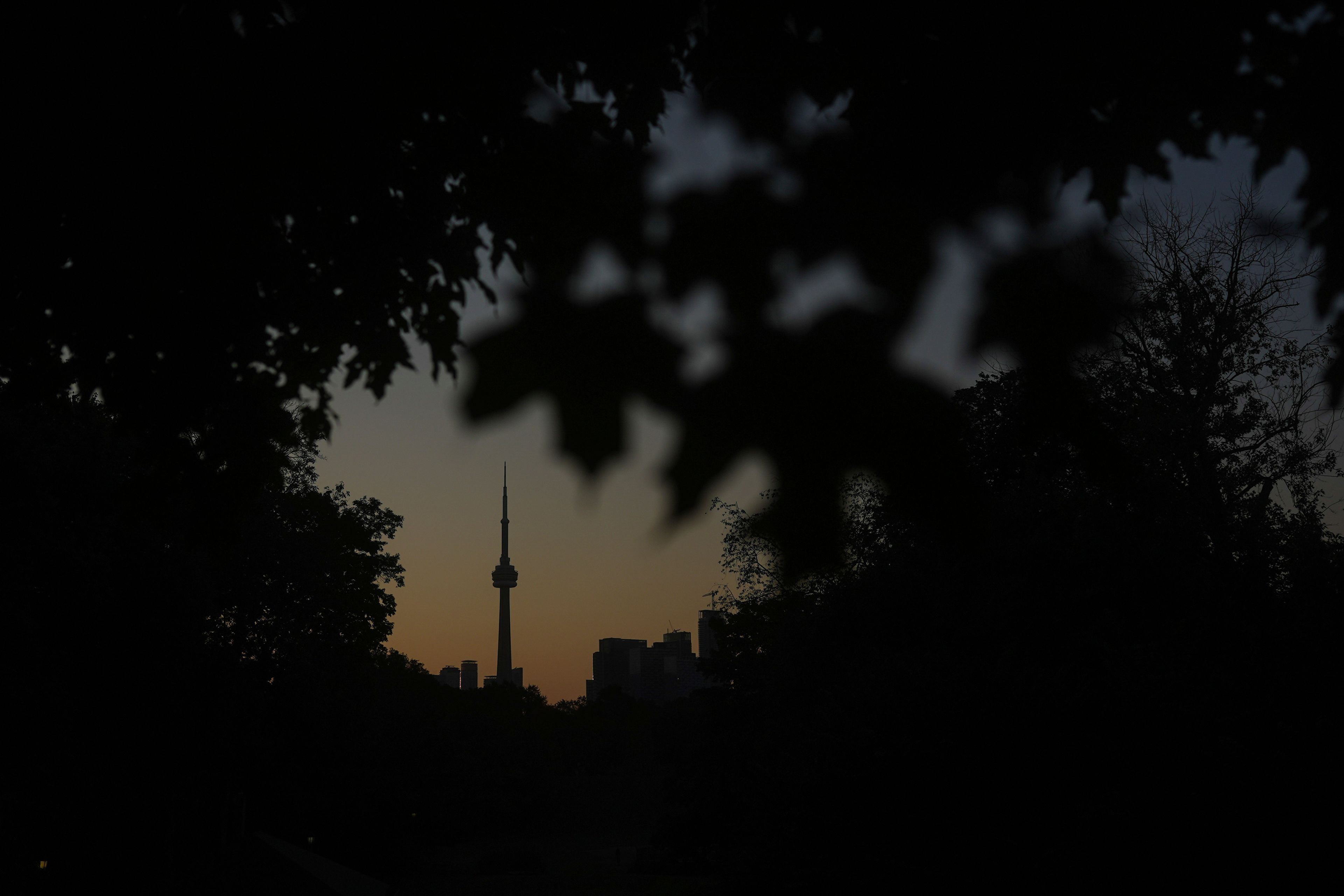 The CN Tower is seen from Trinity Bellwoods Park in Toronto on Wednesday, Sept. 18, 2024. (AP Photo/Angie Wang)