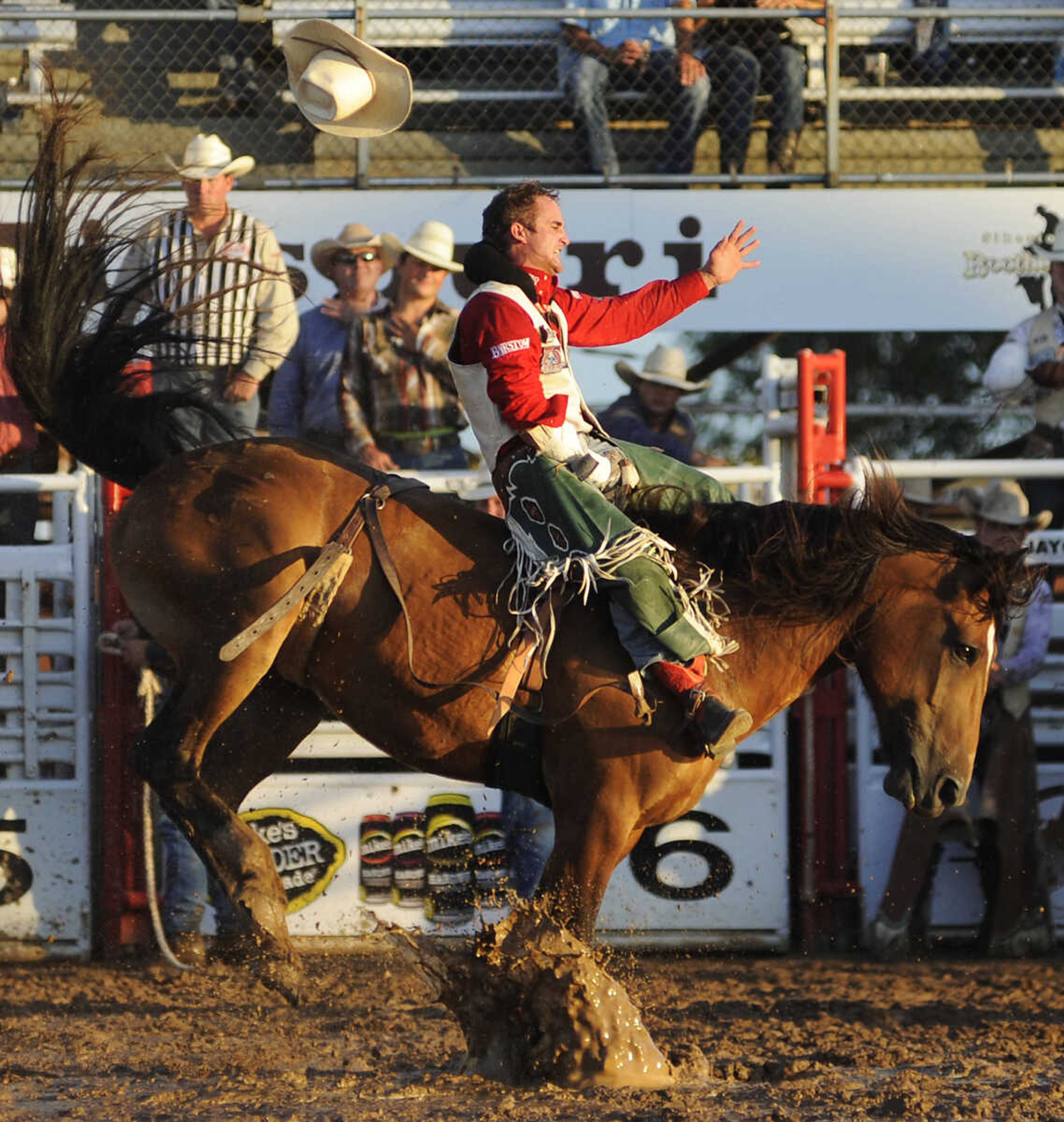 Jared Smith rides Top Flight in the bareback riding competition at the Sikeston Jaycee Bootheel Rodeo Wednesday, August 7, in Sikeston, Mo. Carter received a score of 86 for his ride.