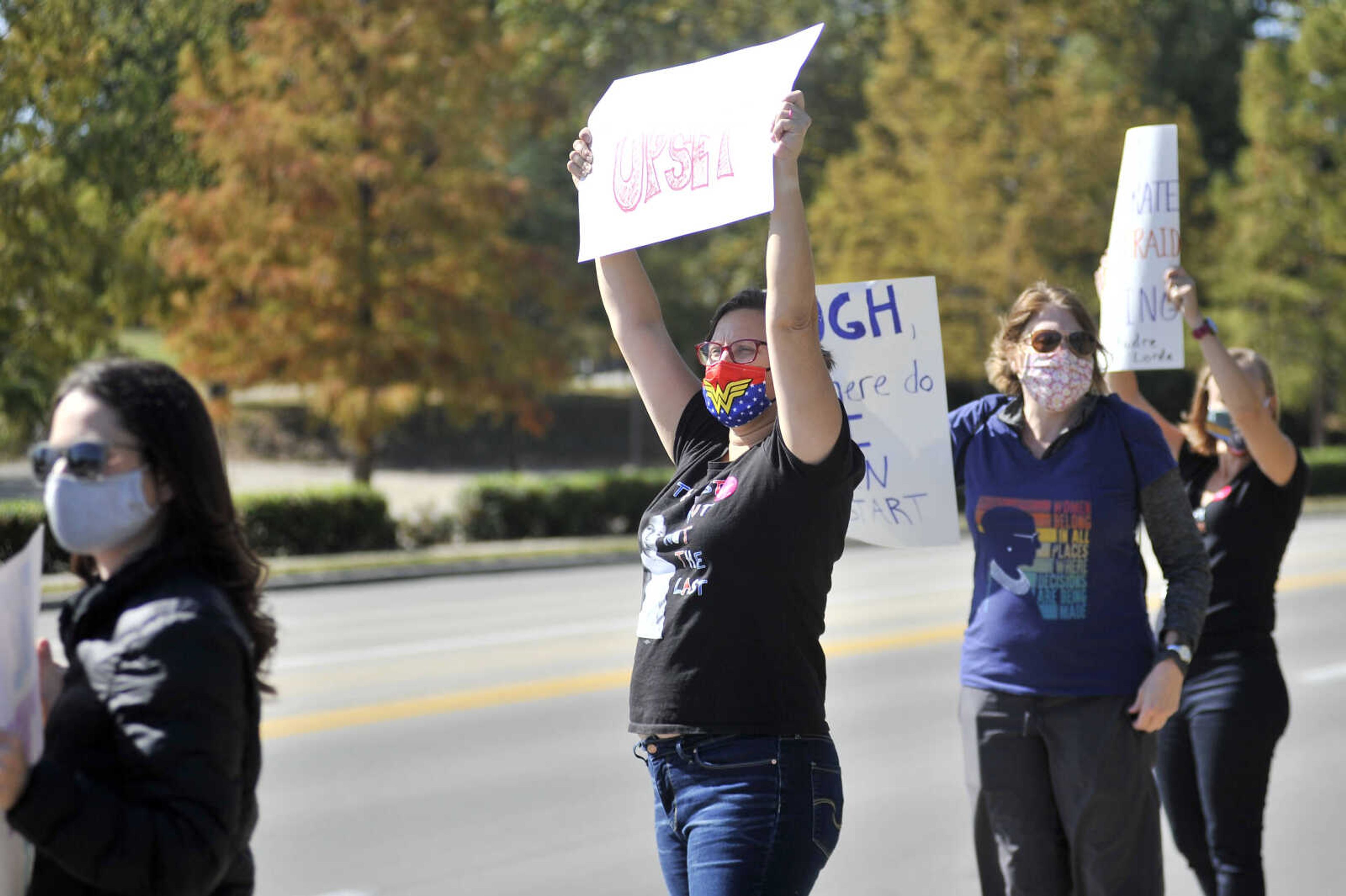 Brooke Holford ~ Southeast Missourian
A group of women hold up hand-written signs in protest during the SEMO Women's March on Saturday, Oct. 17, 2020, at Freedom Corner in Cape Girardeau.