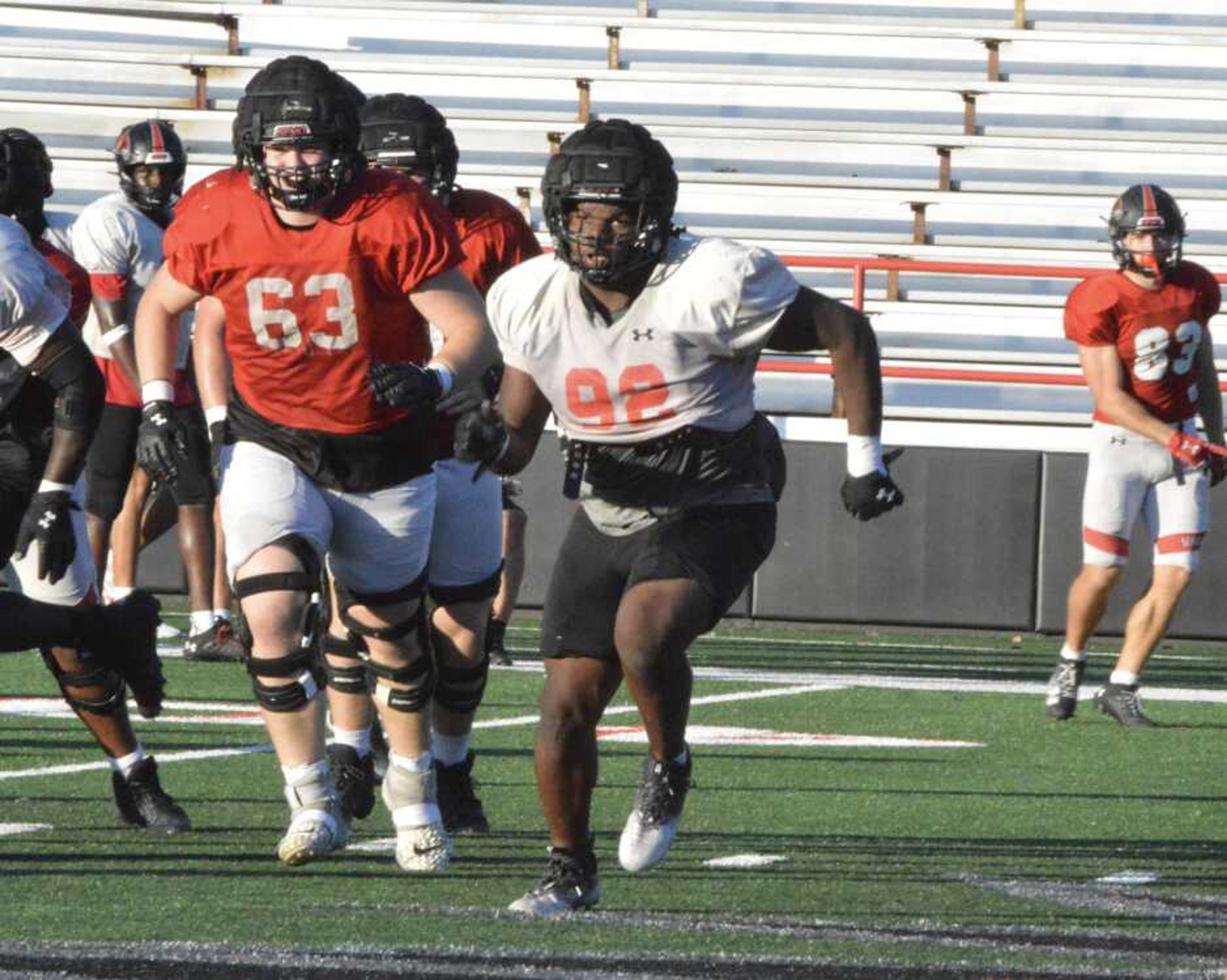 Southeast Missouri State sophomore Jaylon Stone, in white, races to the football during practice Tuesday, Oct. 8, at Houck Field in Cape Girardeau.