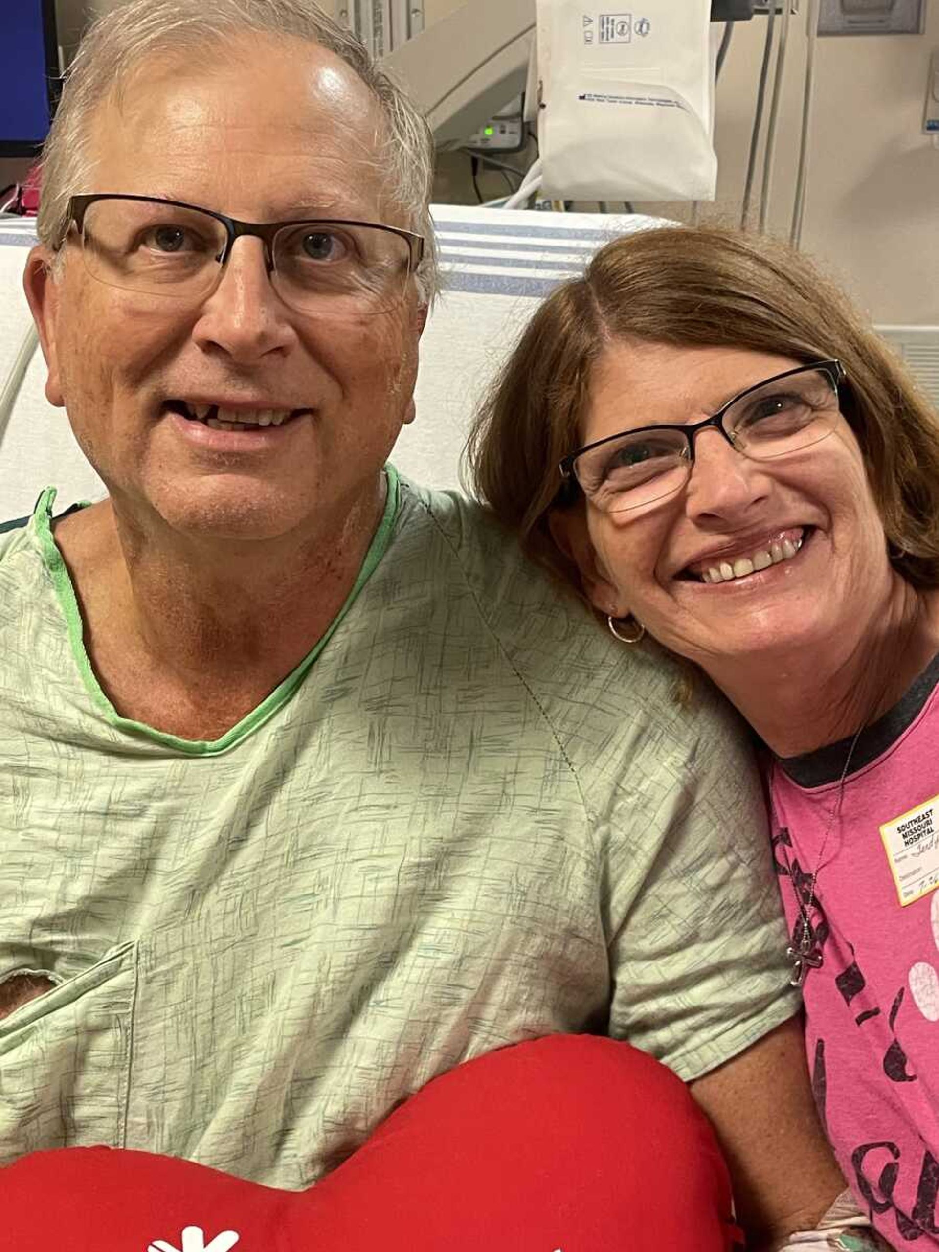 Ray and Sandra Doyle in Ray's hospital bed six days after he was rushed to the hospital.