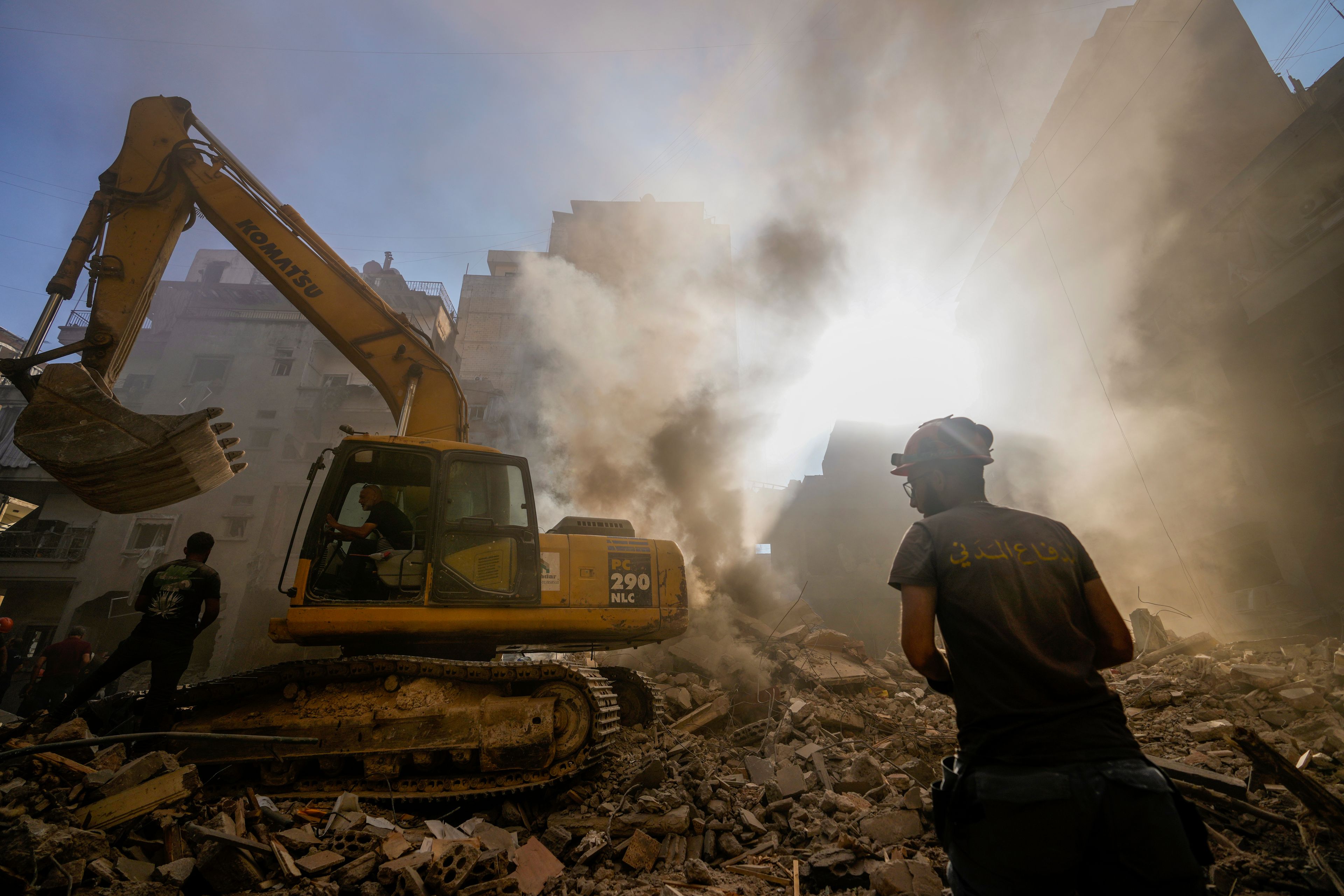 Rescue workers search for victims at the site of Thursday's Israeli airstrike in Beirut, Lebanon, Friday, Oct. 11, 2024. (AP Photo/Hassan Ammar)