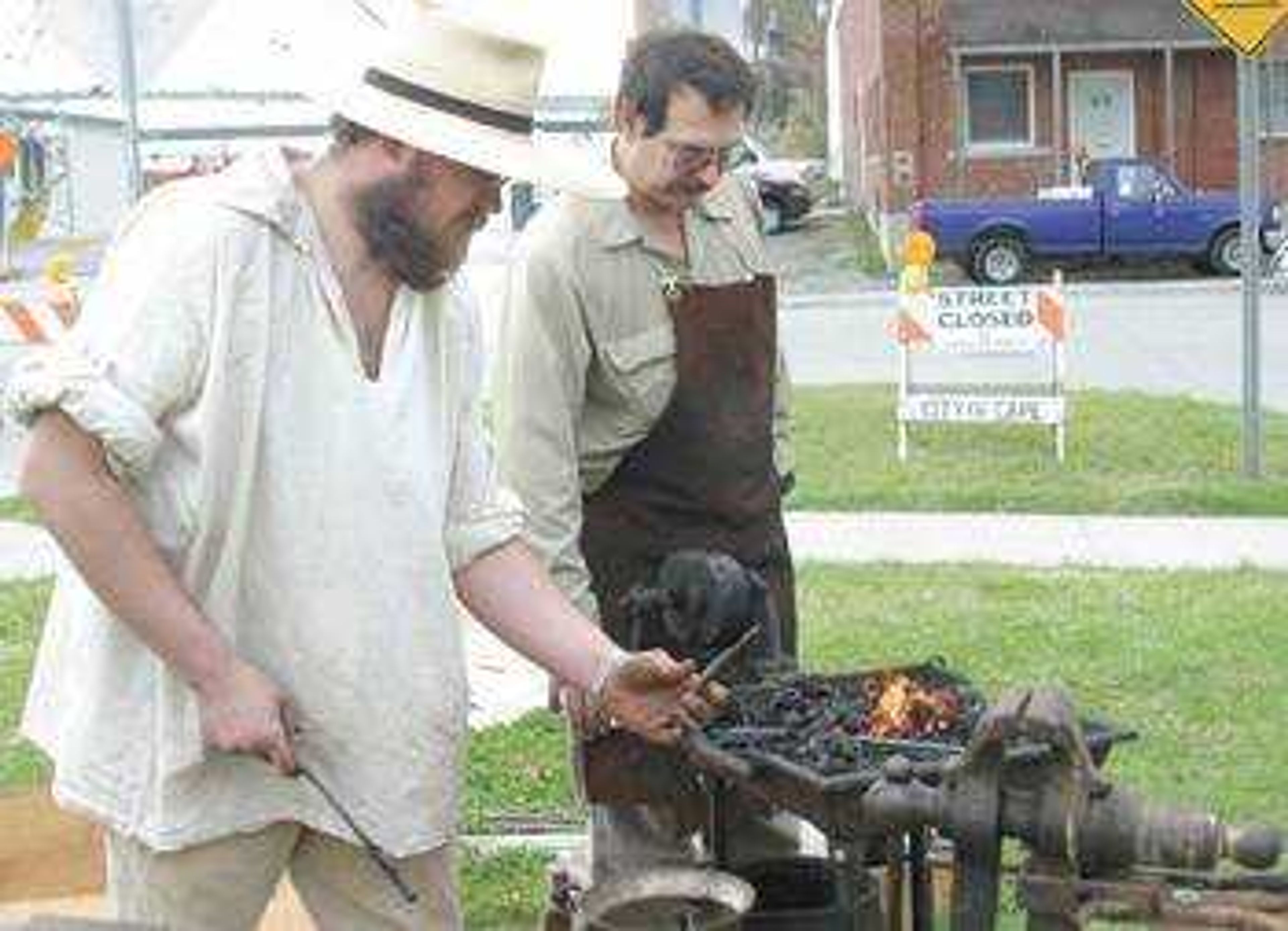 Blacksmiths Bo McCutcheon, left, and John Abernathy made forks.