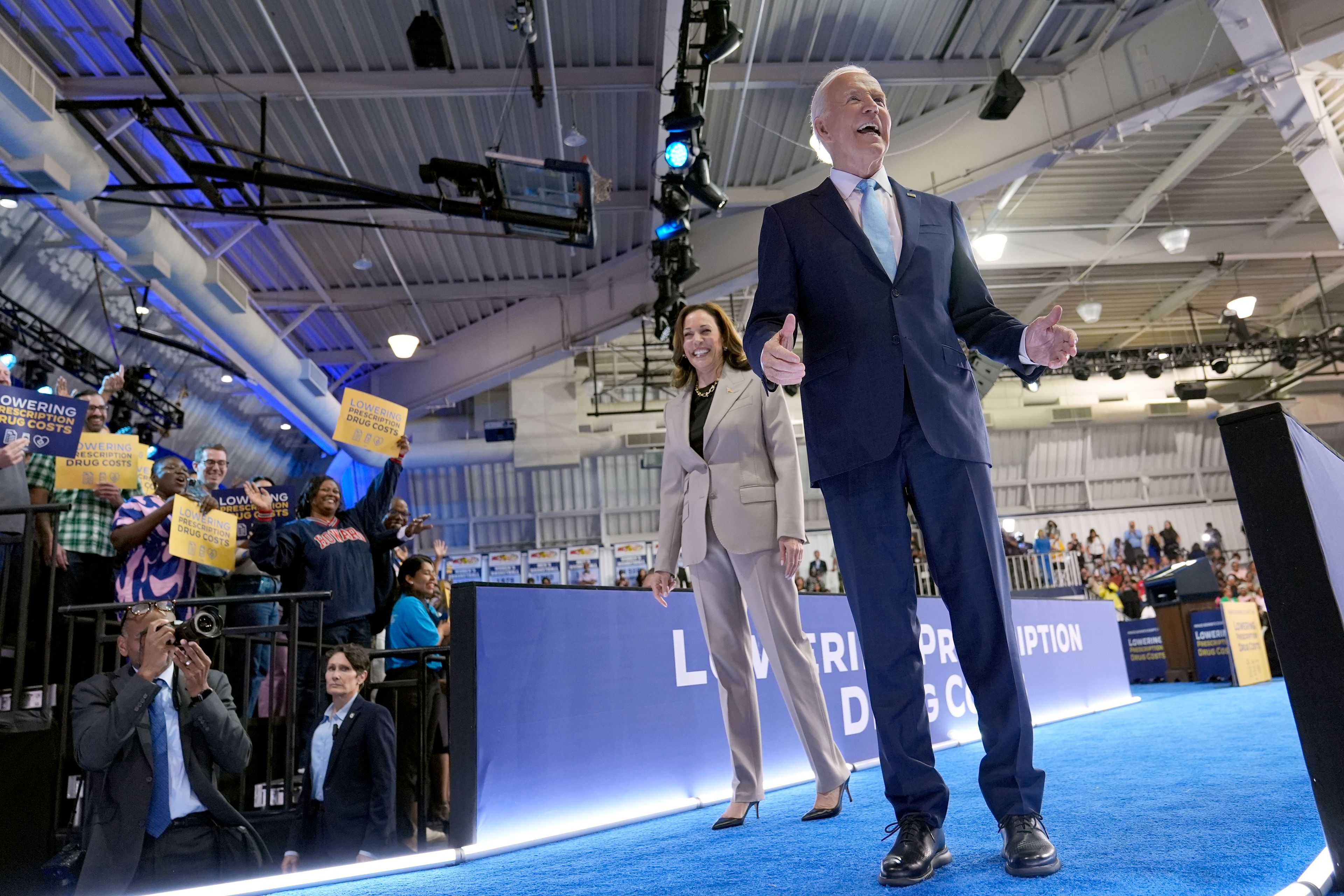 Democratic presidential nominee Vice President Kamala Harris, left, and President Joe Biden depart after speaking about the administration's efforts to lower prescription drug costs during an event at Prince George's Community College in Largo, Md., Thursday, Aug. 15, 2024. (AP Photo/Susan Walsh)